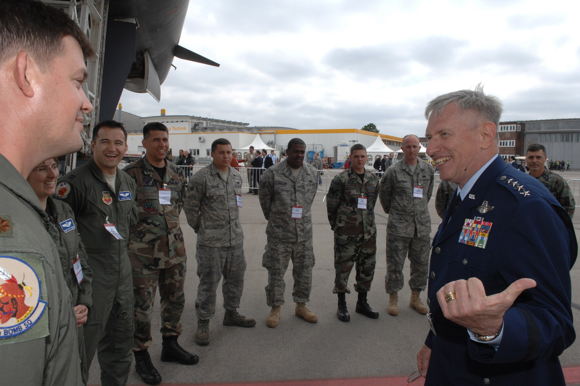Gen. Roger Brady, U.S. Air Forces in Europe Commander, shares a laugh with the B-1B Lancer crew from Dyess Air Force Base, T.X. during his walk through of the U.S. corral at the 2008 Berlin Air Show May 27.  U.S. military participation in the air show contributes to a number of U.S. security and foreign policy interests. Participation promotes standardization and interoperability of equipment with our NATO allies and other potential coalition partners and highlights the strength of the U.S. commitment to the security of Europe. (U.S. Air Force photo by Tech Sgt. Corey Clements) (released)