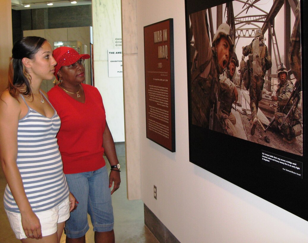 Army reservist Amber Cooper, left, and her aunt, retired Army Lt. Col. Joyce Shambley, look at Gulf War photos that are part of “The American Soldier: A Photographic Tribute to Soldiers and Marines” exhibit on display at the Women in Military Service for America Memorial, May 26, 2008. The exhibit is on display at the memorial through Labor Day. Defense Department photo by Gerry J. Gilmore