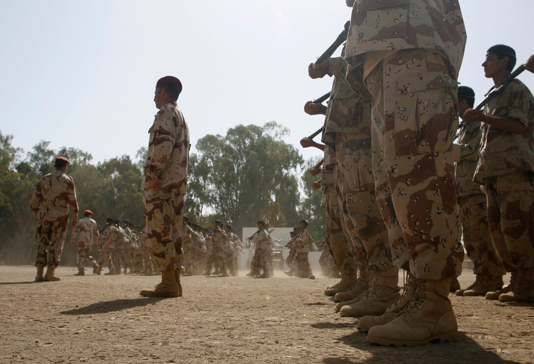 The Iraqi Army's newest soldiers stand in formation during their graduation ceremony at Habbaniyah Regional Training Center, May 28. The Basic Combat Training course had more than 2,100 graduates and focused on weapon safety and marksmanship. It's led by experienced Iraqi soldiers who receive minimal assistance from American or coalition personnel.