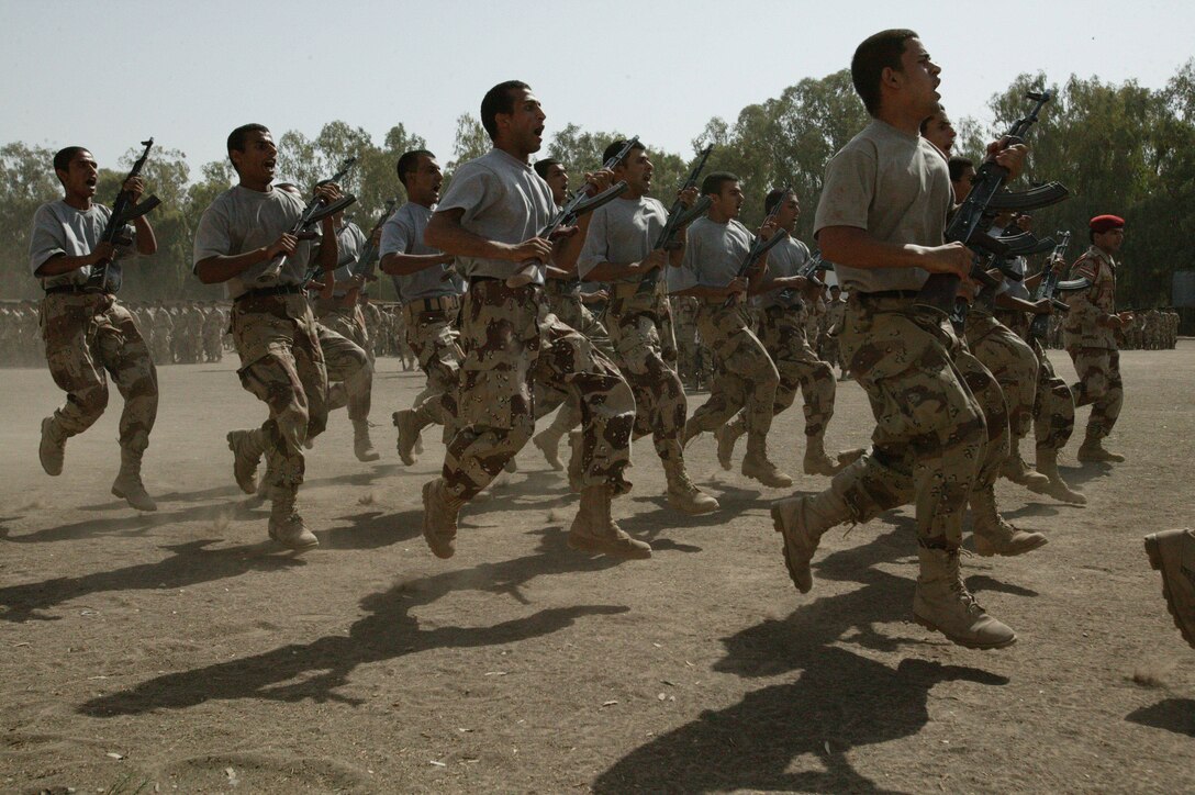 An Iraqi Army drill team puts on a show during the graduation ceremony for a Basic Combat Training course at the Habbaniyah Regional Training Center, May 28. The  course had more than 2,100 graduates and focused on weapon safety and marksmanship. It's led by experienced Iraqi soldiers who receive minimal assistance from American or coalition personnel.