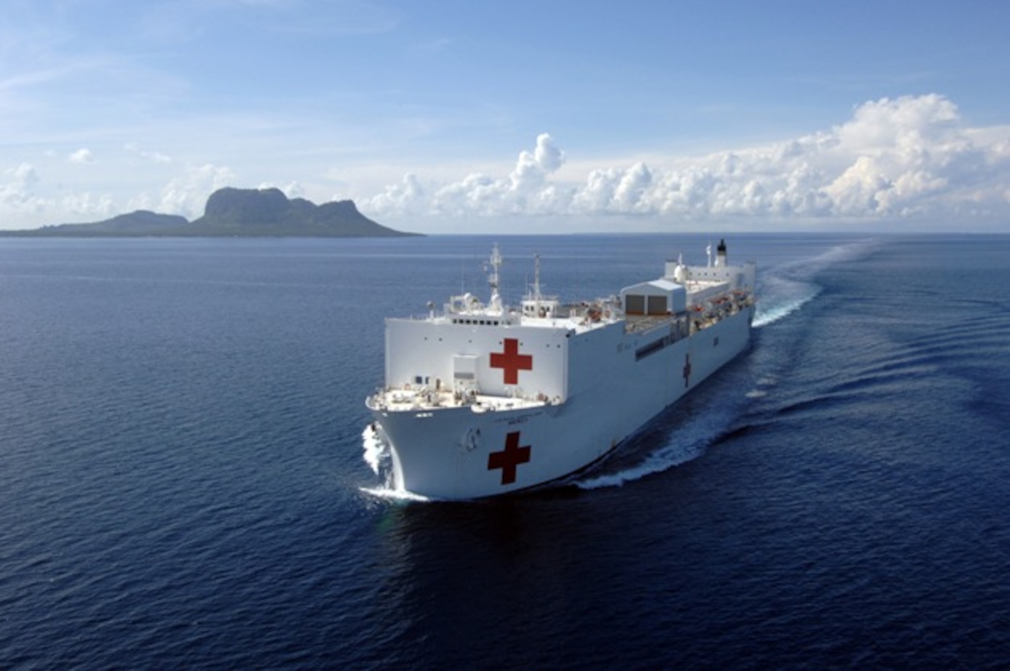The U.S. Naval Ship Mercy (T-AH 19) sets sail for its next port visit after a four-week
stay in the Philippines. Mercy is a hospital ship able to rapidly respond to a range
of situations on short notice and capable of supporting medical and humanitarian
assistance needs with special medical equipment and a multi-specialized medical
team, providing a range of services ashore as well as onboard. (U.S. Navy photo/PHC Edward Martens)