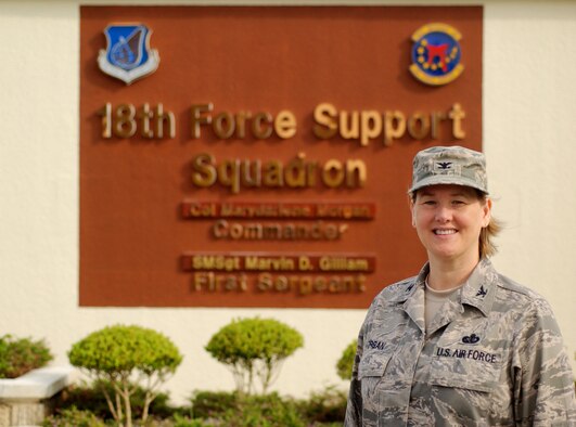Col. MaryDarlene Morgan, 18th Force Support Squadron commander, takes command of more than 2,000 personnel as the 18th Services Squadron and the 18th Mission Support Squadron merge on May 29 at Kadena Air Base, Japan. (U.S. Air Force photo/Tech. Sgt. Rey Ramon) 

