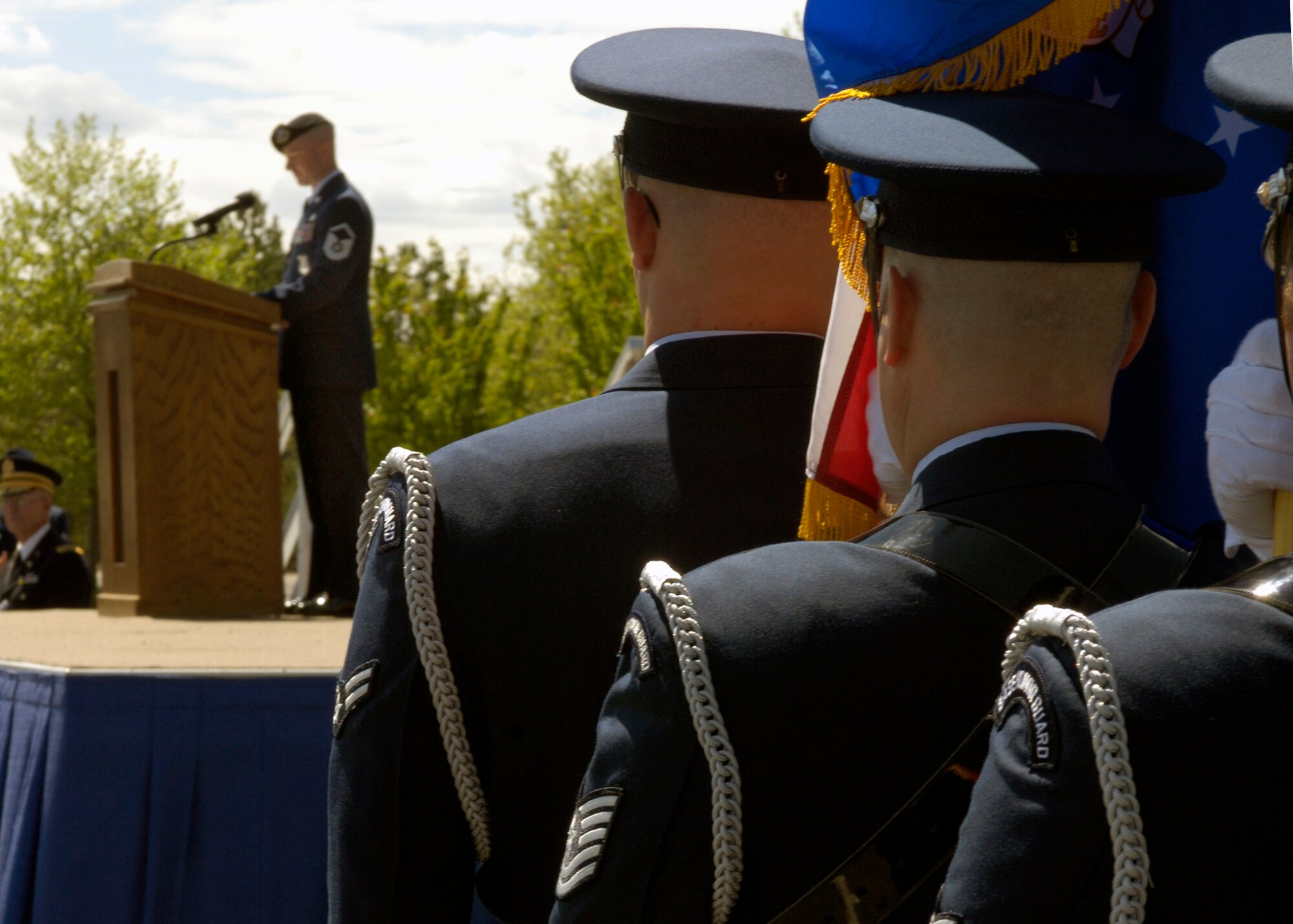 FAIRCHILD AIR FORC E BASE, Wash. – Fairchild Honor Guard members wait for their introduction by the ceremony narrator Master Sgt. Daniel Merrill, 92nd Security Forces Installation security constable, to post the colors during the 92nd Mission Support Group change-of-command ceremony here May 27. (U.S. Air Force photo / Airman 1st Class Melissa Barnett)