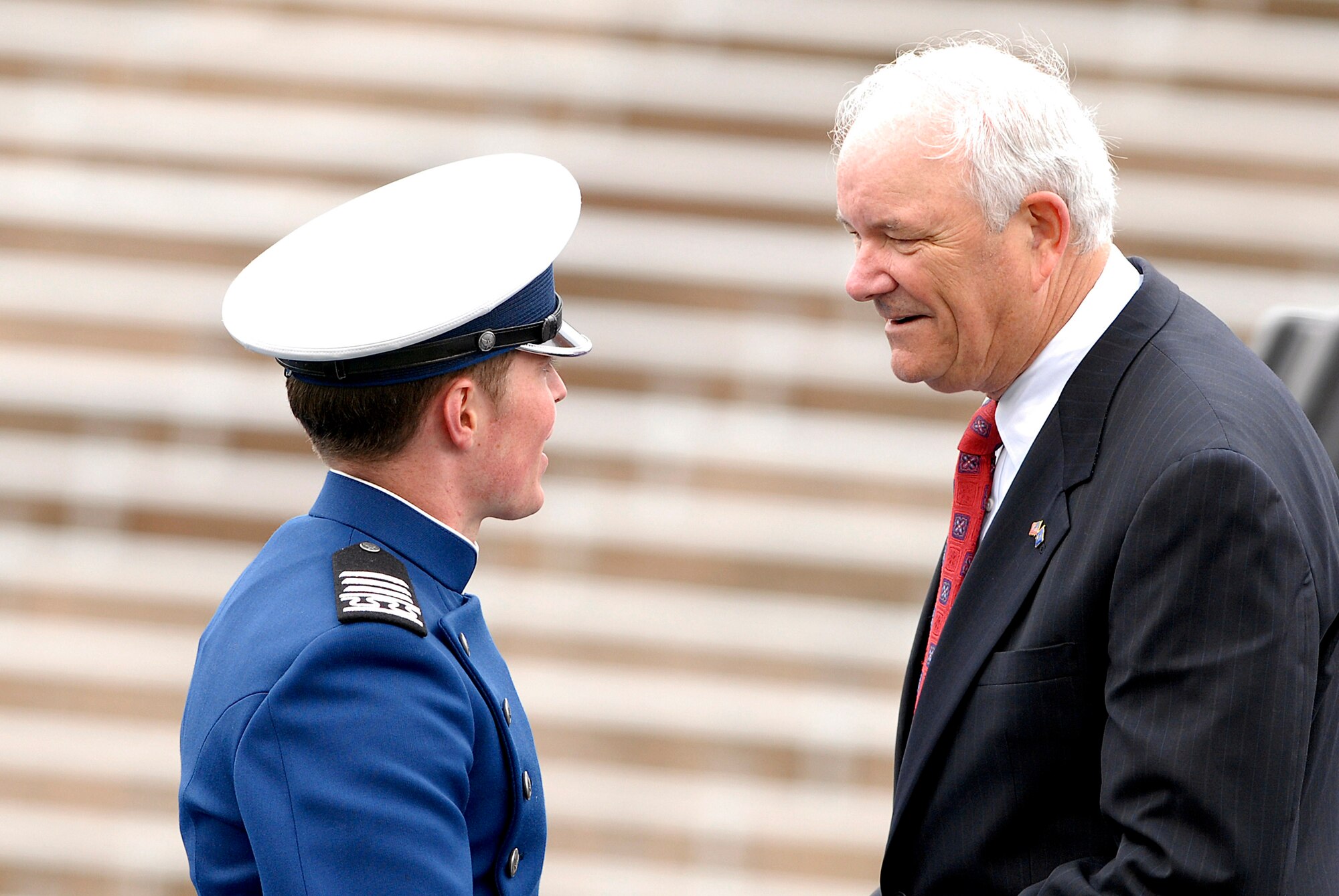 Secretary of the Air Force Michael W. Wynne congratulates newly commissioned 2nd Lt. Andrew Derwae during the U.S. Air Force Academy Class of 2008 graduation ceremony at Falcon Stadium May 28.  (U.S. Air Force photo/Mike Kaplan)