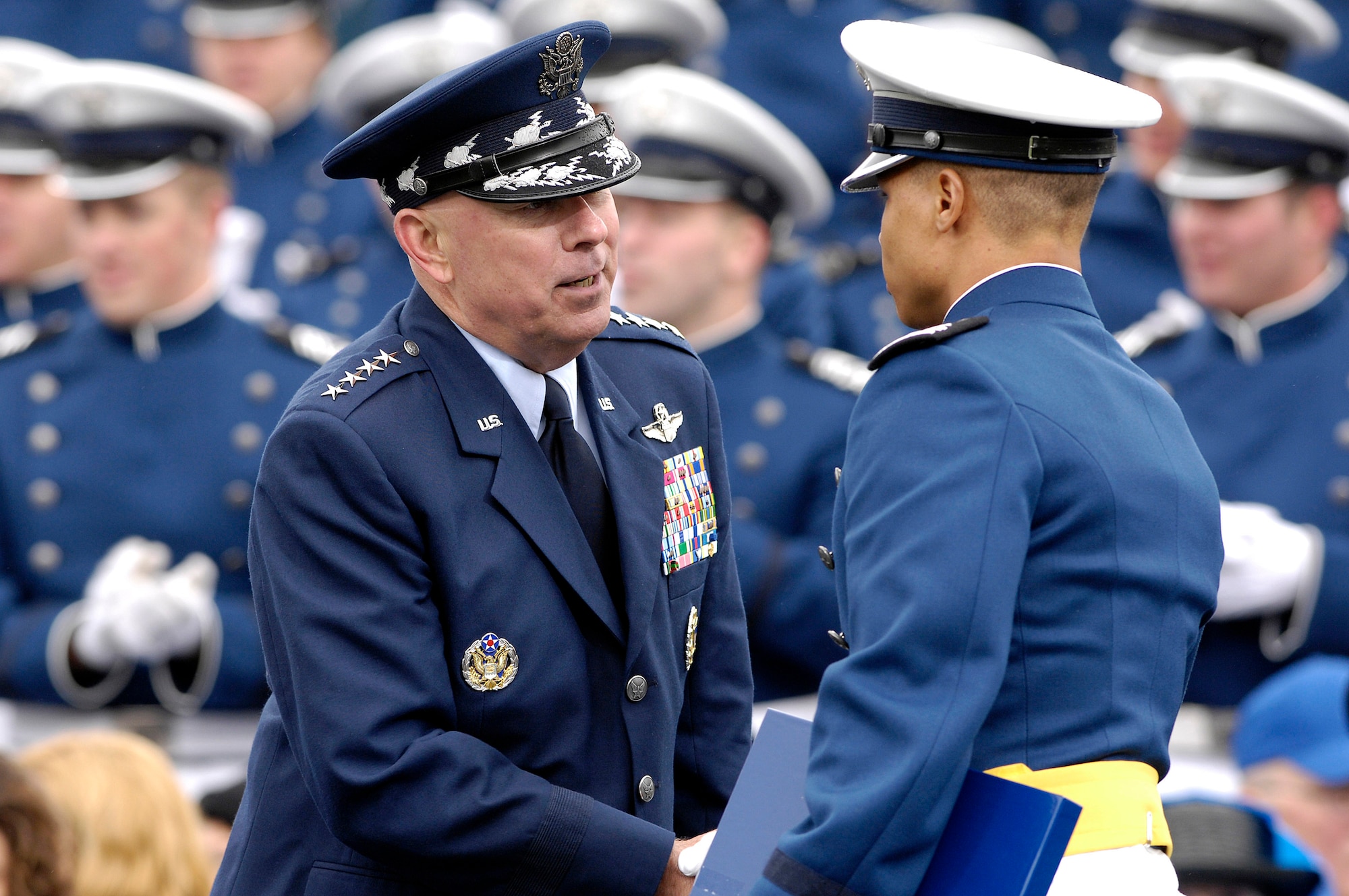Air Force Chief of Staff Gen. T. Michael Moseley offers congratulations to a newly commissioned cadet during the U.S. Air Force Academy Class of 2008 graduation ceremony at Falcon Stadium May 28. The Class of 2008 graduated 1,012 cadets. (U.S. Air Force photo/Mike Kaplan)