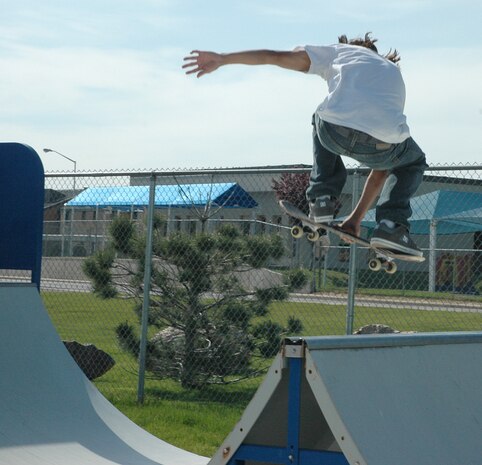 A skater, who doesn’t want to be identified because he is not wearing the required safety gear gets some air after jumping a ramp at the Hill Air Force Base skate park. (U.S. Air Force photo by Airman 1st Class Robby Hedrick)
