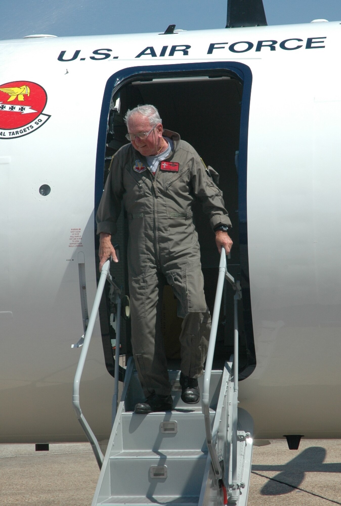 Mr. Gordon Pollard, Lockheed Martin pilot controller, deplanes an E9-A aircraft after completing the final flight of his career culminating over 52 years of service to the Air Force as both an active duty officer and contractor. Pollard retired May 29 after serving  as a pilot controller in support of the 82nd Aerial Targets Squadron’s mission of performing surveillance and gathering telemetry data of weapons systems tested at Tyndall. 