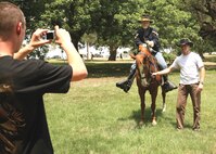 5/9/2008 - DeWayne Henderson, saddle club manager at Lackland Air Force Base, Texas, poses with his horse Risky during the Defense Language Institute annual AMIGO picnic on May 9. Mr. Henderson also performed a historical re-enactment of an Army Civil War cavalryman during the event.
(USAF photo by Robbin Cresswell)
