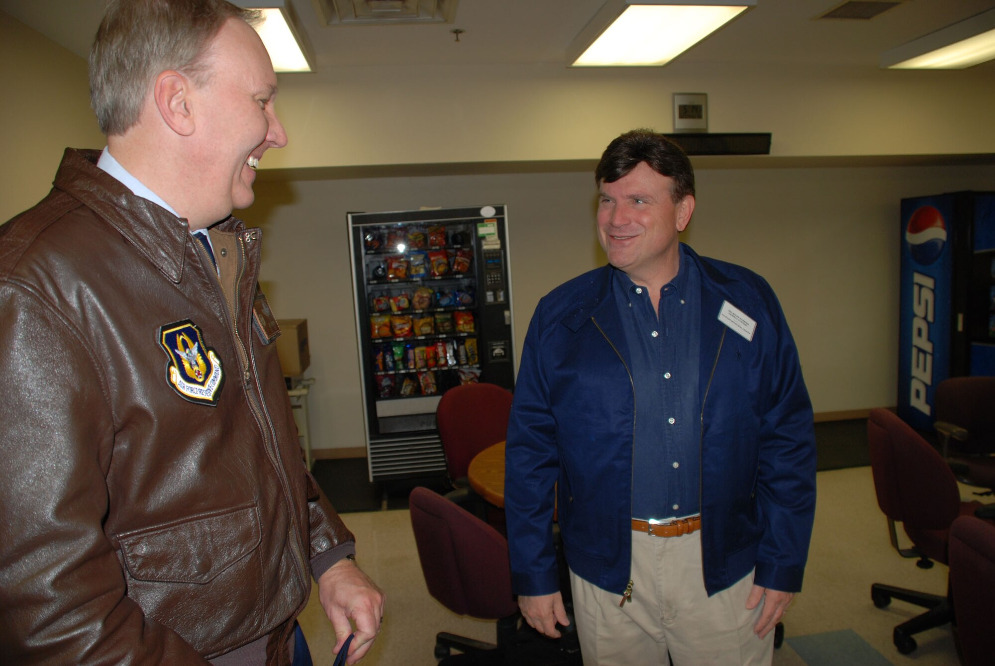 Col. Jeff Johnson welcomes a civic leader to an early arrival and breafast at the 932nd Airlift Wing.  This flight started with an early showtime of 0430 a.m.  Pilots from the 932nd Airlift Wing tell civic leaders about the C-9C aircraft as they enjoyed learning about the 932nd Airlift Wing and its various missions.  Thirty-nine civic leaders, including mayors, primarily from Southern California, the Chicago region and a few communities surrounding Scott Air Force Base went on the flight.  The event was designed to help educate and inform the public about the mission.  Photo/Maj. Stan Paregien