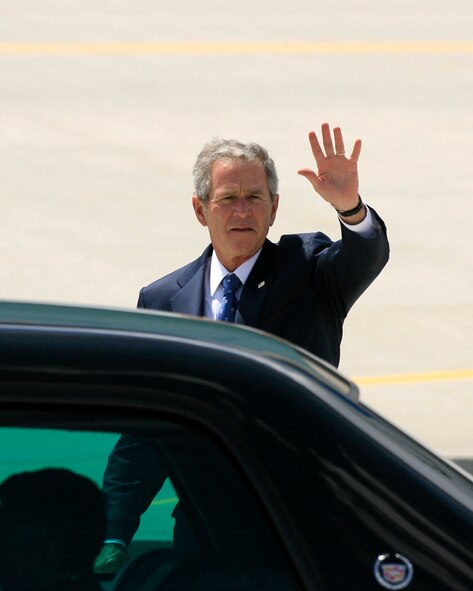 President George W. Bush waves to members of the Utah Air National Guard shortly after landing in Salt Lake City.  President Bush was in town on a funding raising effort for presidential hopeful Senator John McCain.  U.S. Air Force Photo by Tech. Sgt. Michael D. Evans  