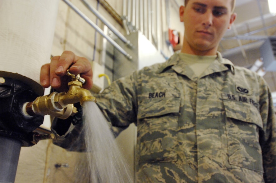 MOODY AIR FORCE BASE, Ga. -- Airman Joshua Beach, a utilities systems specialist with the 23rd Civil Engineer Squadron, tests a water spigot after installing it here May 29. (U.S. Air Force photo by Staff Sgt. Joshua T. Jasper)