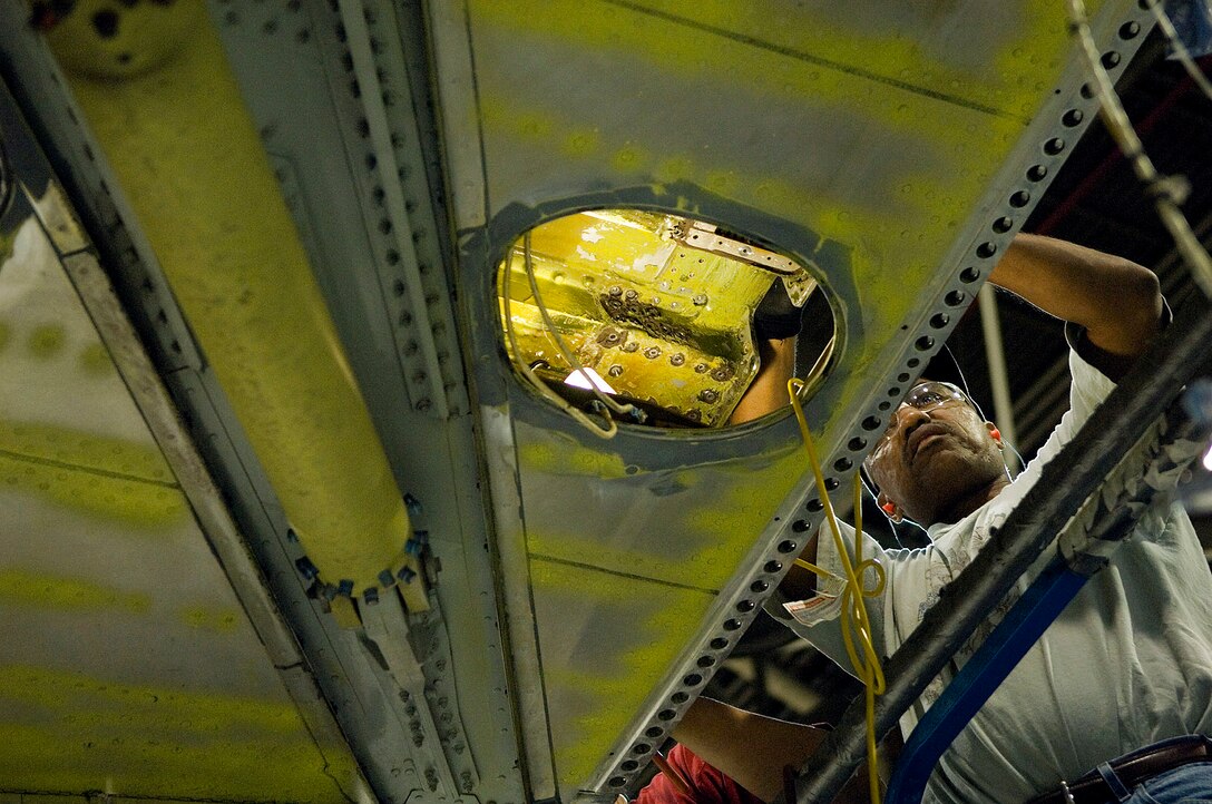 Maurice Hopson conducts maintenance on the production brake of a KC-135R Stratotanker inside the Oklahoma Air Logistics Center hanger being prepared for full maintenance overhaul May 14. (U.S. Air Force photo/Staff Sgt. Bennie J. Davis III)