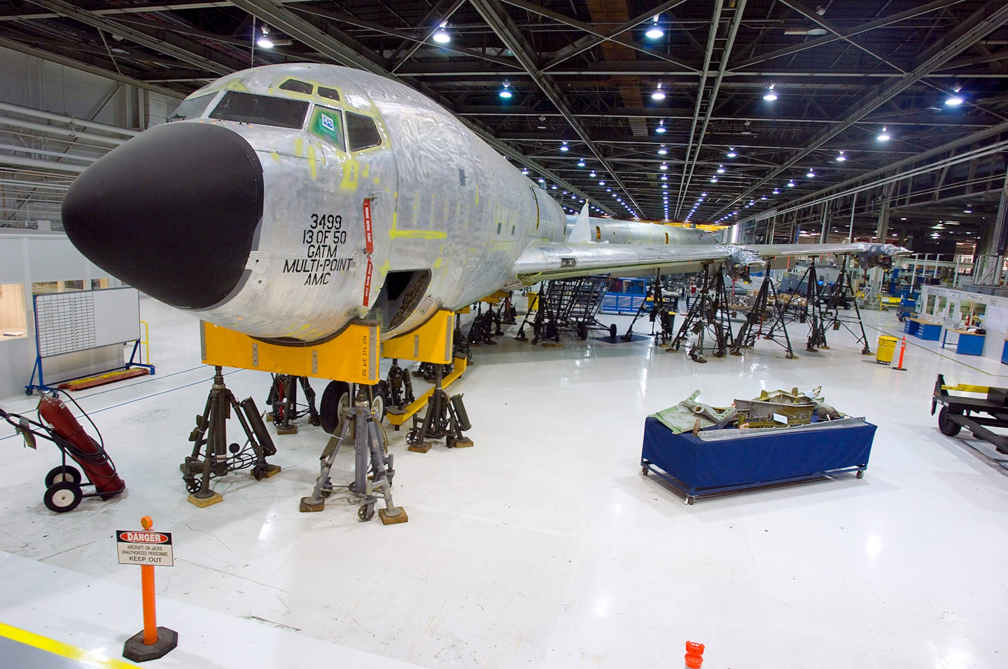 An aging KC-135R Stratotanker sits inside the Oklahoma Air Logistics Center, Okla., waiting for a full maintenance overhaul May 14. The Oklahoma Air Logistics Center is the worldwide manager for a wide range of aircraft, engines, missiles, software and avionics and accessories components. The center manages an inventory of 2,261 aircraft which include the B-1, B-2, B-52, C/KC-135, E-3, VC-25, VC-137 and 25 other contractor logistics support aircraft. (U.S. Air Force photo/Staff Sgt. Bennie J. Davis III)