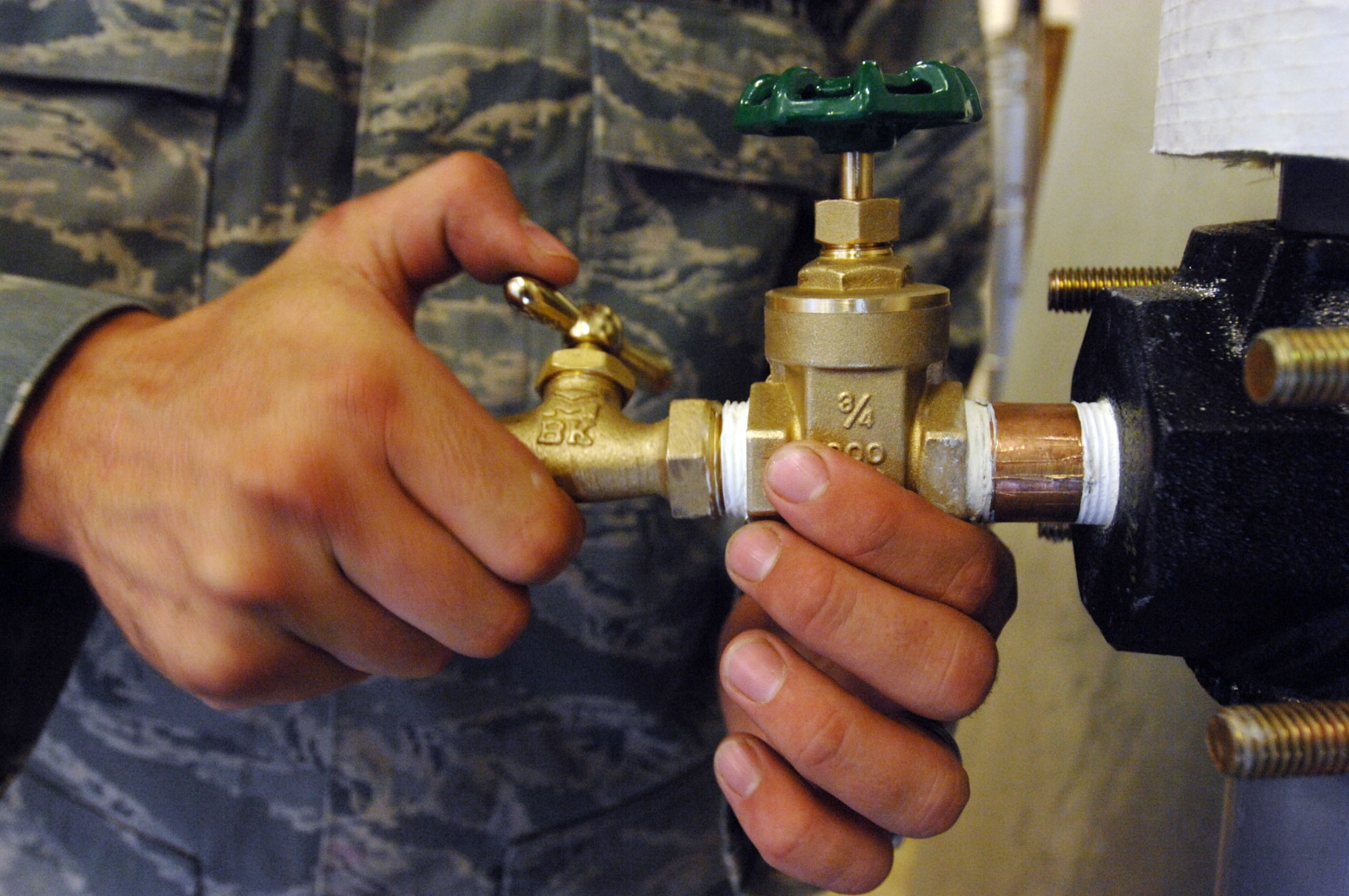 MOODY AIR FORCE BASE, Ga. -- Airman Joshua Beach, 23rd Civil Engineering Squadron utilities system specialist, installs a spigot into a fixture here after tapping new threads here May 29. Airman Beach is responsible for the maintenance and repair of water and plumbing equipment. (U.S. Air Force photo by Staff Sgt. Joshua T. Jasper) 