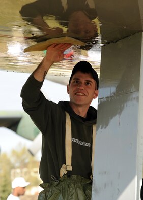 ELMENDORF AFB Alasks - Staff Sgt Jason Lowe, 3rd Mission Support Squadron, helps clean the aircraft at Heritage Park in front of the 3rd Wing Headquarters building May 22, 2008. The static displays are required to be washed biannually per an Air Force Instruction. (U.S. Air Force photo by Airman 1st Class Laura Turner)