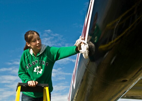 ELMENDORF AFB Alaska - Airman 1st Class Mariko Baird, 3rd Security Forces Squadron, wipes off an aircraft during the static display wash May 22,2008. More than 50 volunteers washed the 10 static displays on base. (U.S. Air Force photo by Airman 1st Class Kristin High) 

