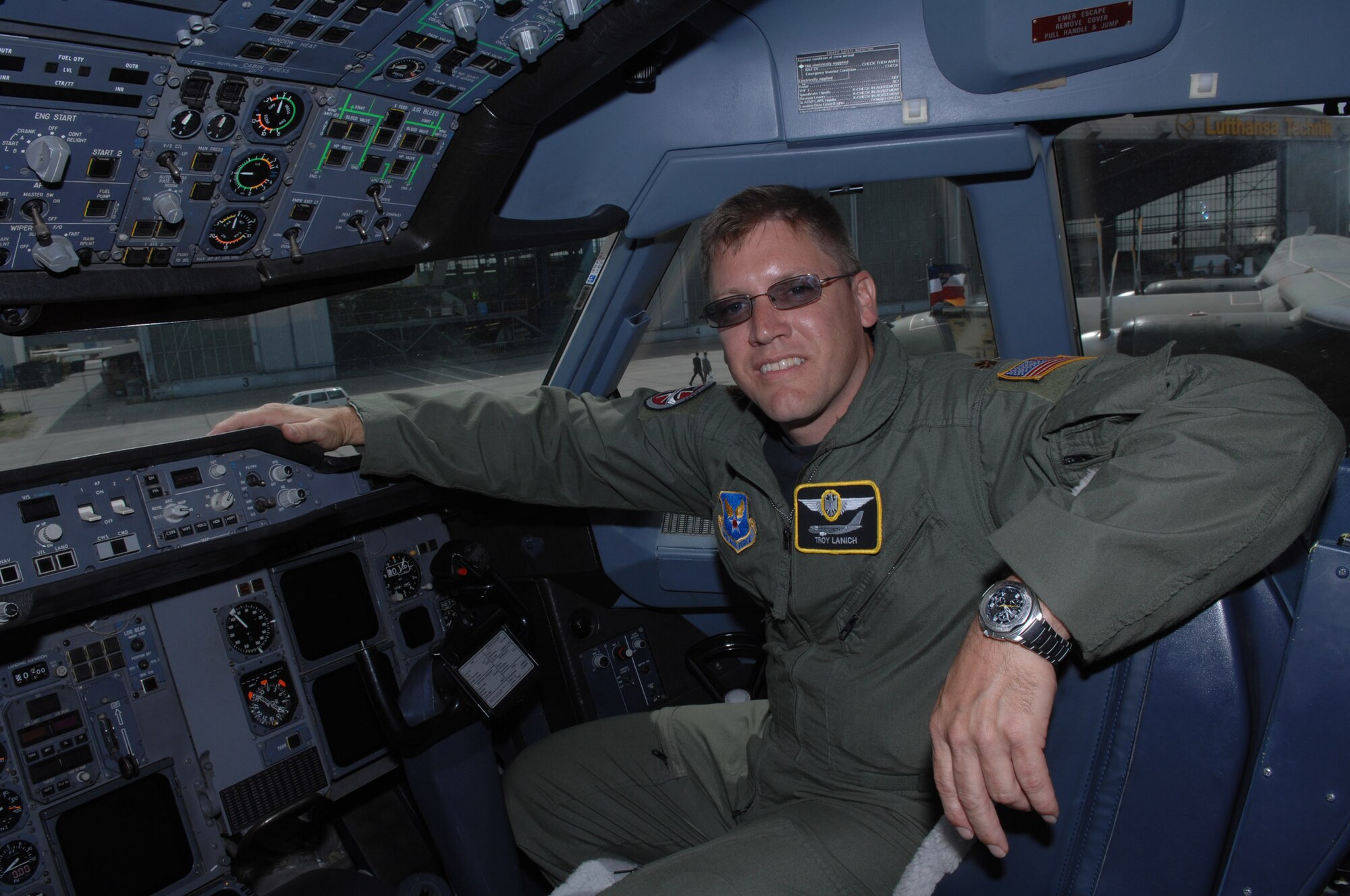 BERLIN, Germany - U.S. Air Force airlift pilot Maj. Troy Lanich sits in the cockpit of an Airbus 310 aircraft he flies while on the exchange pilot program May 29.  Maj. Lanich has been assigned to the German air force Special Air Mission Wing for over a year and is here at the airshow with the unit to showcase the aircraft. (U.S. Air Force photo by Tech Sgt. Corey Clements) (released)
