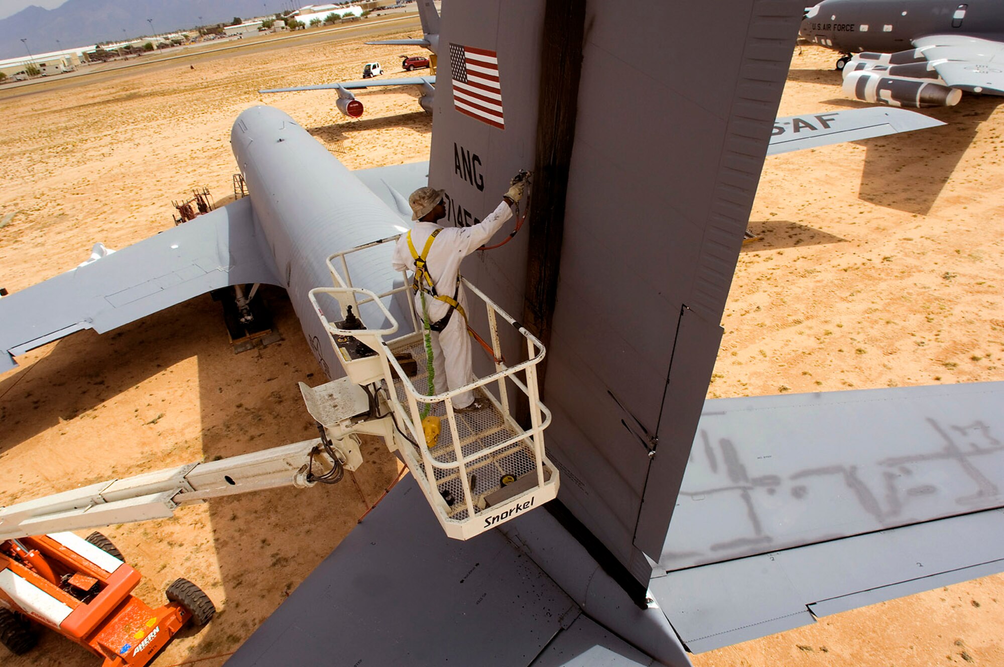 Juan Thomas sprays a protective sealant on the tail of a KC-135E Stratotanker to prepare the aircraft for storage and preservation at the Aerospace Maintenance and Regeneration Group storage site at Davis Monthan Air Force Base, Ariz. AMARG's mission has evolved beyond merely the storage and preservation of aircraft.  Today the center provides customer services including aircraft regeneration which means restoring aircraft to flying status, limited depot-level maintenance, parts reclamation, historic storage and disposal functions.  (U.S. Air Force photo/Bennie J. Davis III)
