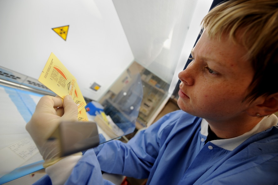 MOODY AIR FORCE BASE, Ga. -- Staff Sgt. Patricia Hill, 23rd Medical Group lab technician, checks a stool sample for hidden blood at the laboratory here May 29. The samples are checked using a liquid solution to determine whether they are positive or negative. (U.S. Air Force photo by Senior Airman Gina Chiaverotti)