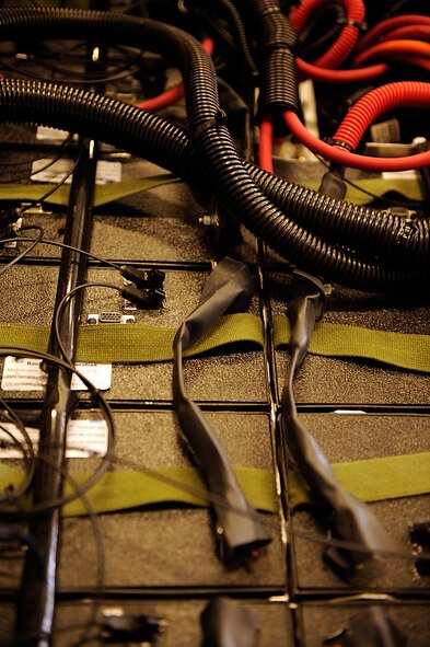 MOODY AIR FORCE BASE, Ga. -- Members of the 23rd Equipment Maintenance Squadron Aerospace Ground Equipment shop use an electric munitions loader as part of a testing period for future electric-powered vehicles here. The electric munitions loader is powered by 20 lithium ion batteries seen here. (U.S. Air Force photo by Airman 1st Class Brittany Barker)