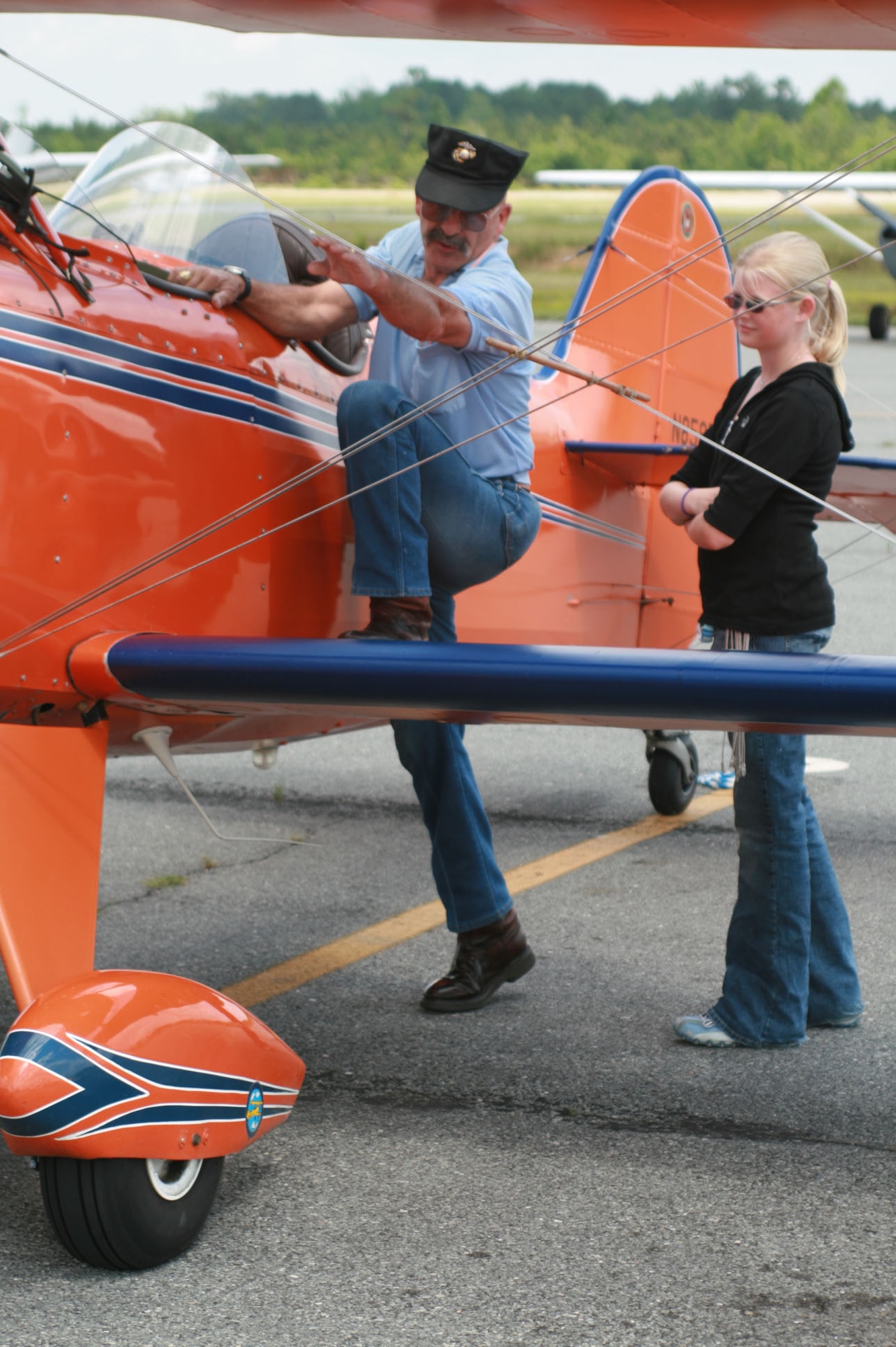 SEYMOUR JOHNSON AIR FORCE BASE, N.C. - Stephen Torrent, pilot, shows 12-year-old Nixon Waters how to climb into his Steen Skybolt during the Experimental Aircraft Association Young Eagles Day at the Goldsboro/Wayne County Municipal Airport May 24.  More than 80 base youth participated in the day's activity.  The EAA Young Eagles program was launched in 1992 to give interested young people an opportunity to go flying in a general aviation airplane. These flights are offered free of charge and are made possible through the EAA member volunteers. (U.S. Air Force photo by Staff Sgt. Les Waters)