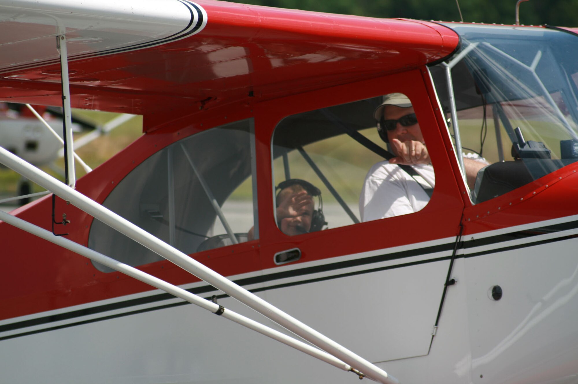 SEYMOUR JOHNSON AIR FORCE BASE, N.C. - Lt. Col. James Jinnette, 335th Fighter Squadron commander, flew four 1/2 year old Landry Waters in his Aeronca 7 Champion airplane during the Experimental Aircraft Association Young Eagles Day at the Goldsboro/Wayne County Municipal Airport May 24.  More than 80 base youth participated in the day's activity.  The EAA Young Eagles program was launched in 1992 to give interested young people an opportunity to go flying in a general aviation airplane. These flights are offered free of charge and are made possible through the EAA member volunteers. (U.S. Air Force photo by Staff Sgt. Les Waters)