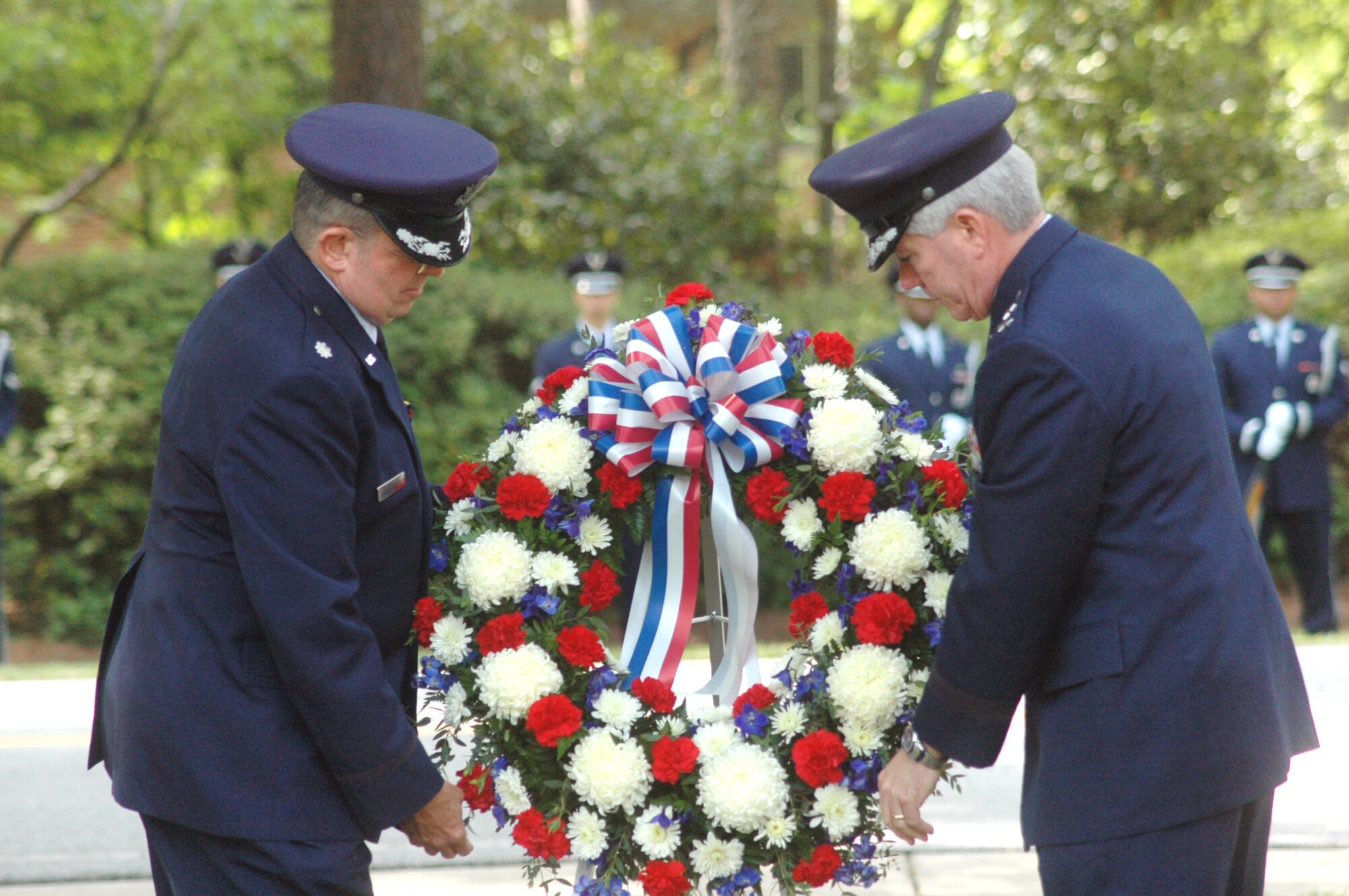 Chaplain (Lt. Col.) Thomas Fey and Maj. Gen. Tom Owen lay a wreath at the Camellia Garden Memorial Service May 22. U. S. Air Force photo by Sue Sapp