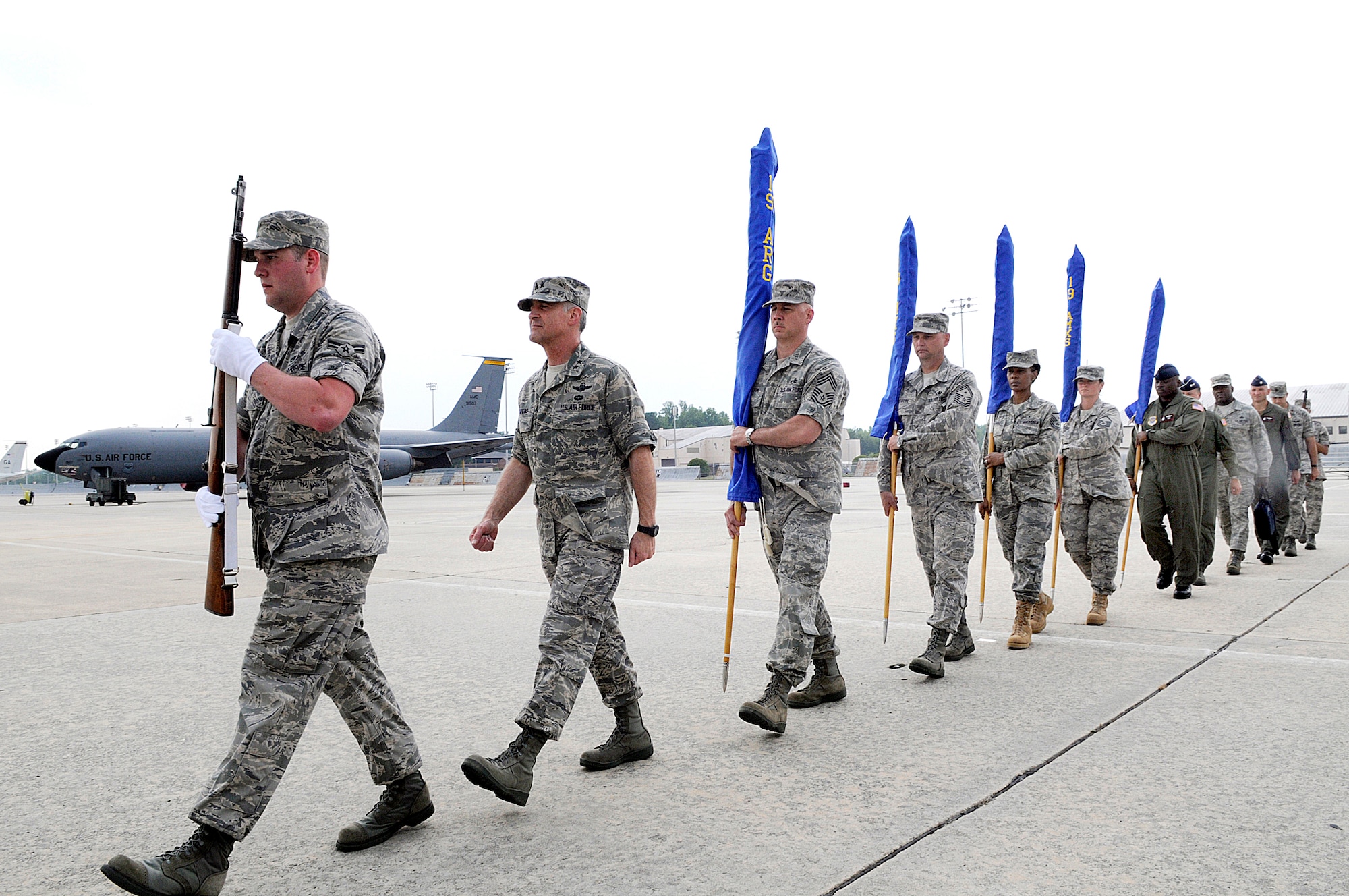 The furled and sleeved squadron and group flags are marched to the "Cherokee Rose" for departure. U. S.  Air Force photo by Sue Sapp