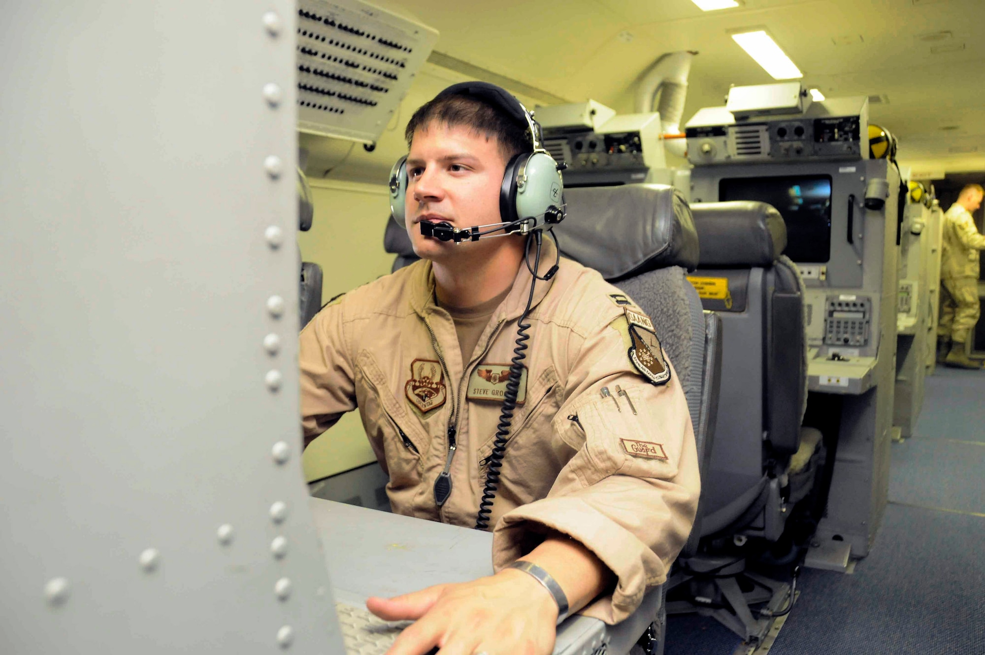 Capt. Steve Grogan controls an operator workstation inside a Joint STARS aircraft May 19. Captain Grogan is the 7th Expeditionary Airborne Command and Control Squadron senior director. (U.S. Air Force photo/Senior Airman Domonique Simmons)

