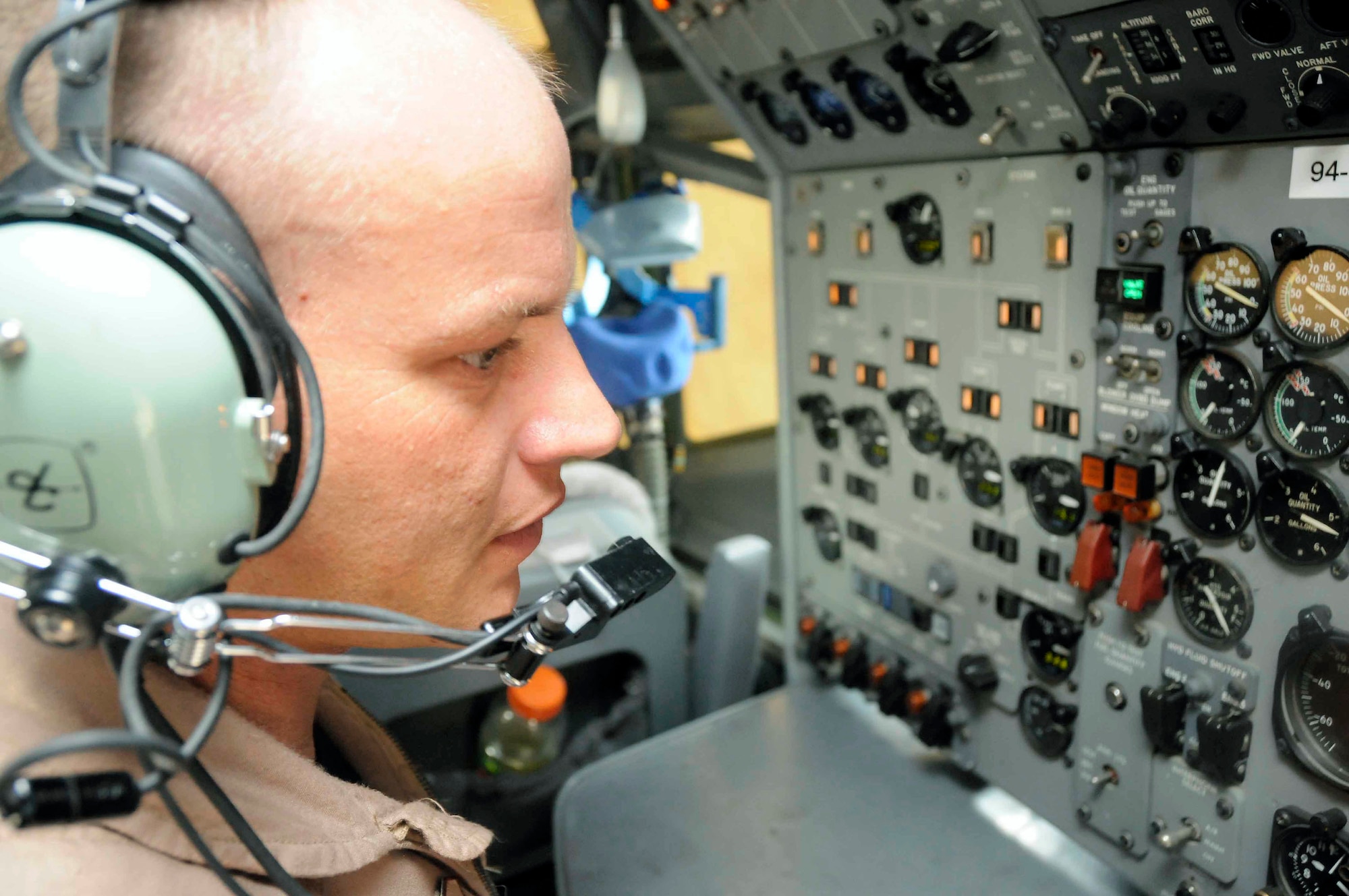 Tech. Sgt. Mike Arnold performs pre-flight checks inside the cockpit of a modified Boeing 707 May 19. Sergeant Arnold is deployed with the 7th Expeditionary Airborne Command and Control Squadron. (U.S. Air Force photo/Senior Airman Domonique Simmons)

