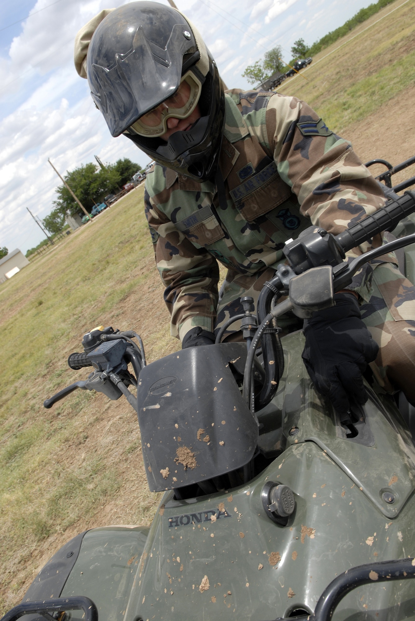 Airman 1st Class Jeremy Smith, 17th Security Forces Squadron, does a quick safety inspection on his ATV during the ATV Rider Course. Airman Smith was one of seven Airmen to participate in the first ATV Rider Course at Goodfellow. (U.S. Air Force photo by Senior Airman Kamaile Chan)
