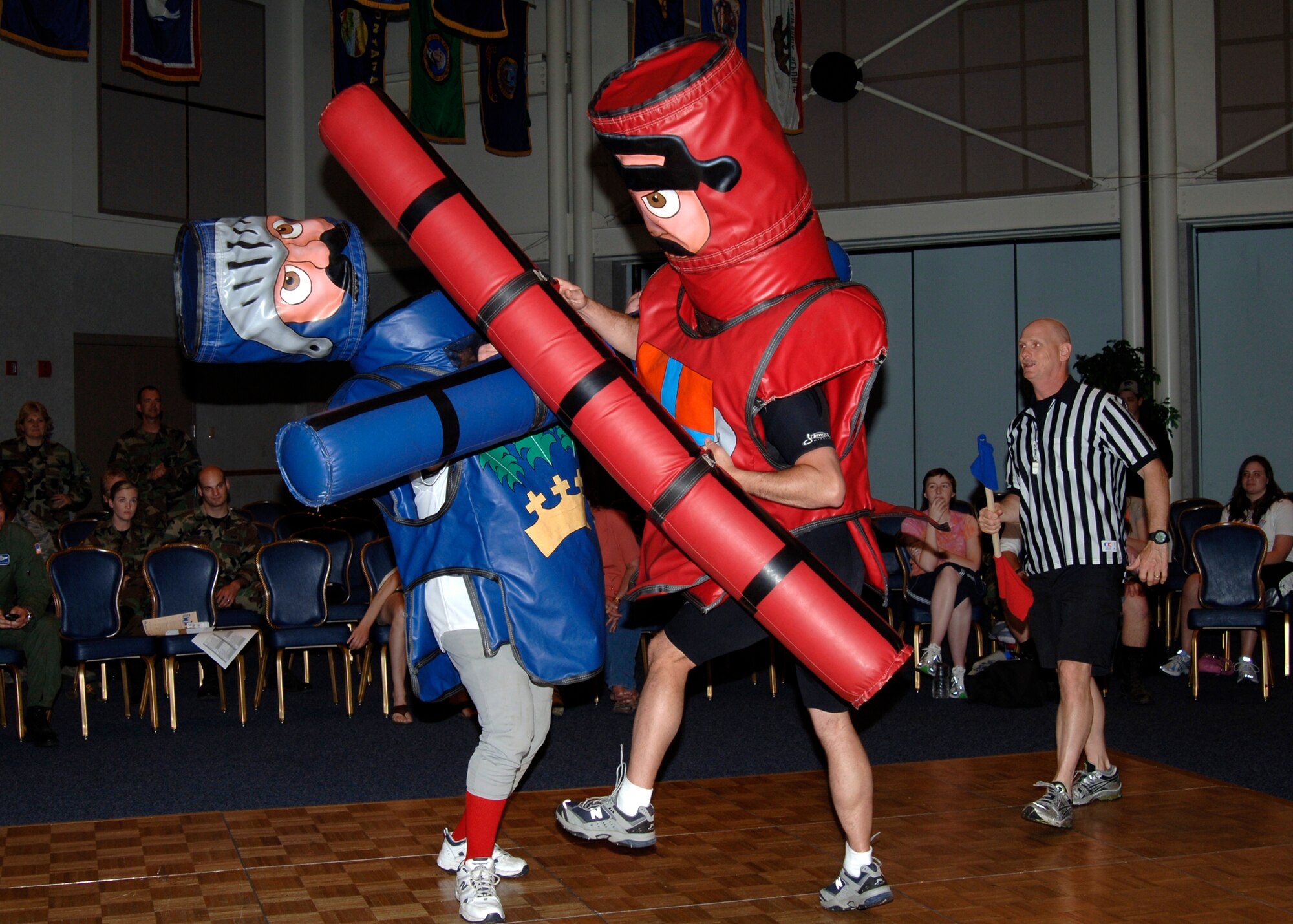MCCONNELL AIR FORCE BASE, Kan. -- Master Sgt. Jason Nystrom, 22nd Mission Support Squadron First Sergeant, smacks Senior Master Sgt. Ray Pelletier, 22nd Operations Support Squadron, with a foam lance during a wing joust tournament, at the Robert J. Dole Center ballroom, May 22. (Photo by Airman Justin Shelton)