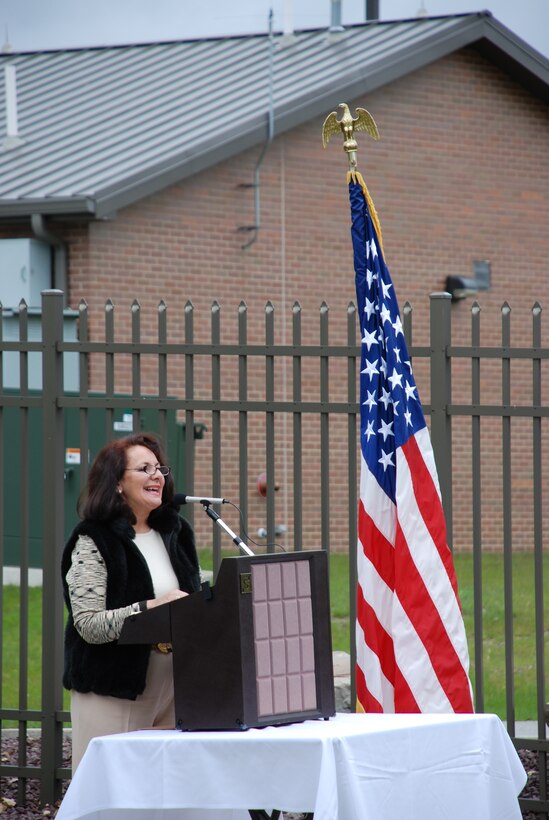 YOUNGSTOWN AIR RESERVE STATION, Ohio - Sandra Pike, daughter of Richard and Gilda Alberini expresses fond memories of her father's dedication and loyalty to his country and the 910th as well as the Alberini's appreciation for the memorial dedicated to him, just minutes before the memorial's headstone is unveiled.