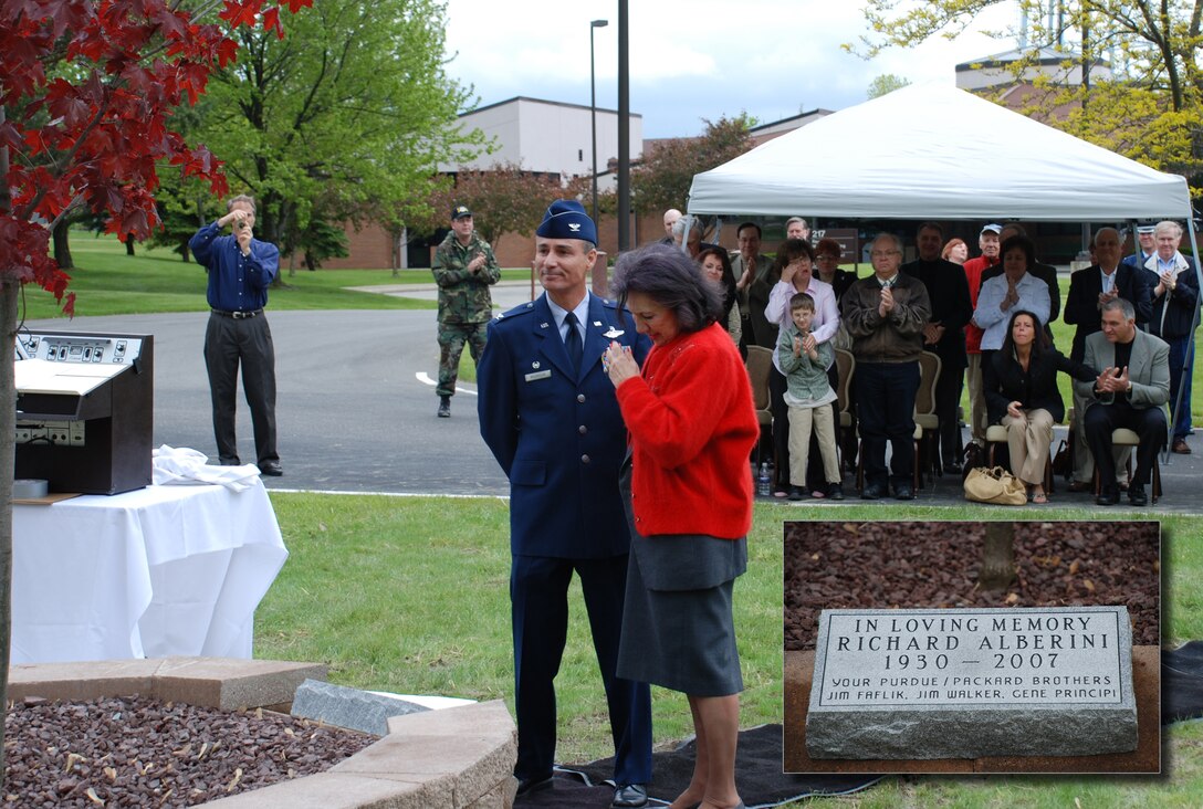 Air Force Reserve Col. Karl McGregor and Gilda Alberini, wife of the late Richard Alberini, admire a memorial dedicated to Richard Alberini and his outstanding support of the 910th Airlift Wing shortly after unveiling the dedication stone. The 910th Airlift Wing hosted a ceremony to dedicate the memorial May 22, 2008. About 40 family members and friends of Mr. Alberini attended the event. The inset photo shows a closeup of the memorial's stone. 