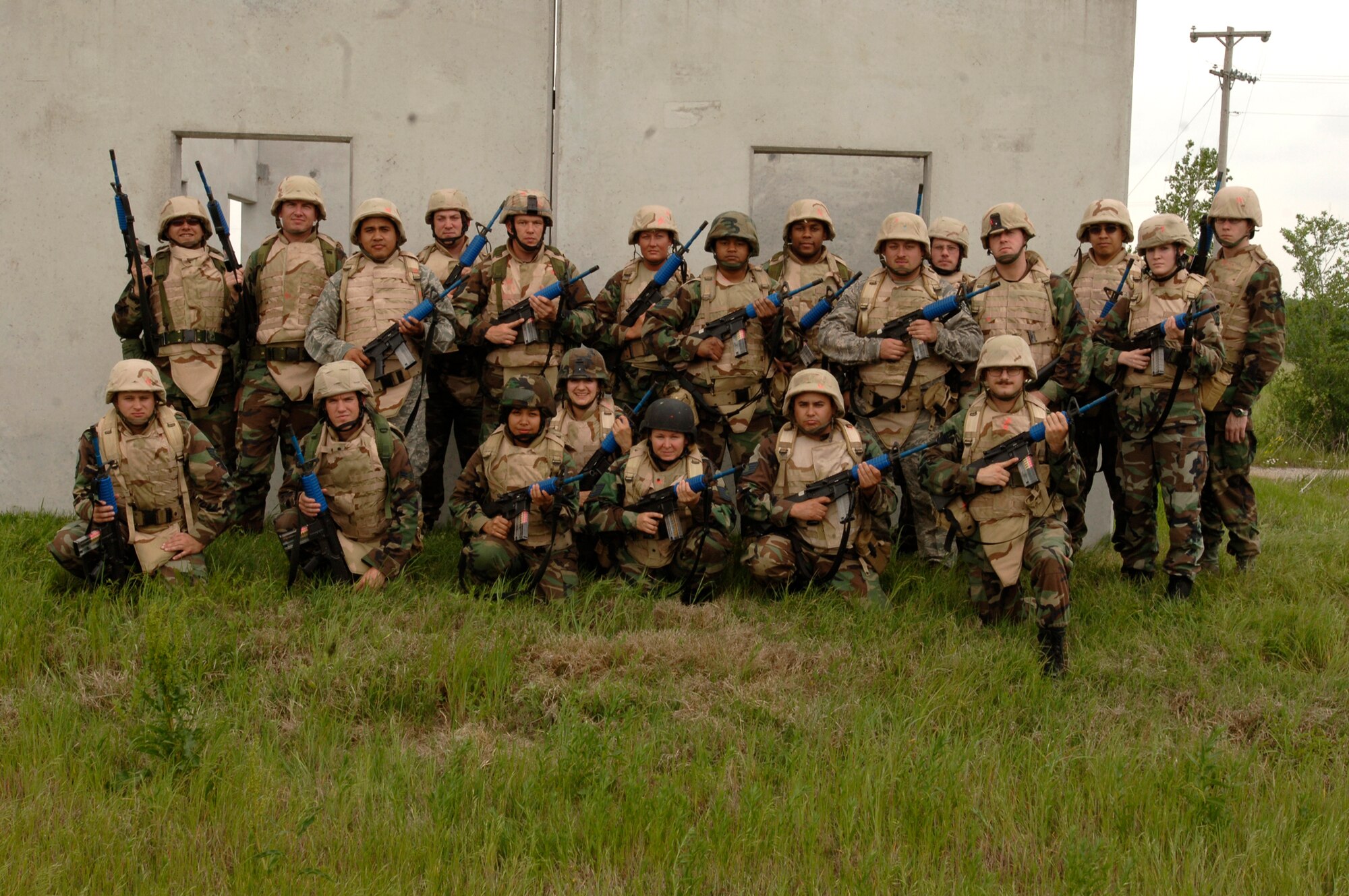 MCCONNELL AIR FORCE BASE, Kan. -- Team McConnell members from various squadrons attended a combat skills training class at the base confidence course May 22 in preparation for their future deployment. The students reviewed techniques such as low crawling and clearing a building by 22nd Security Forces Squadron personnel. (Photo by Airman Justin Shelton)