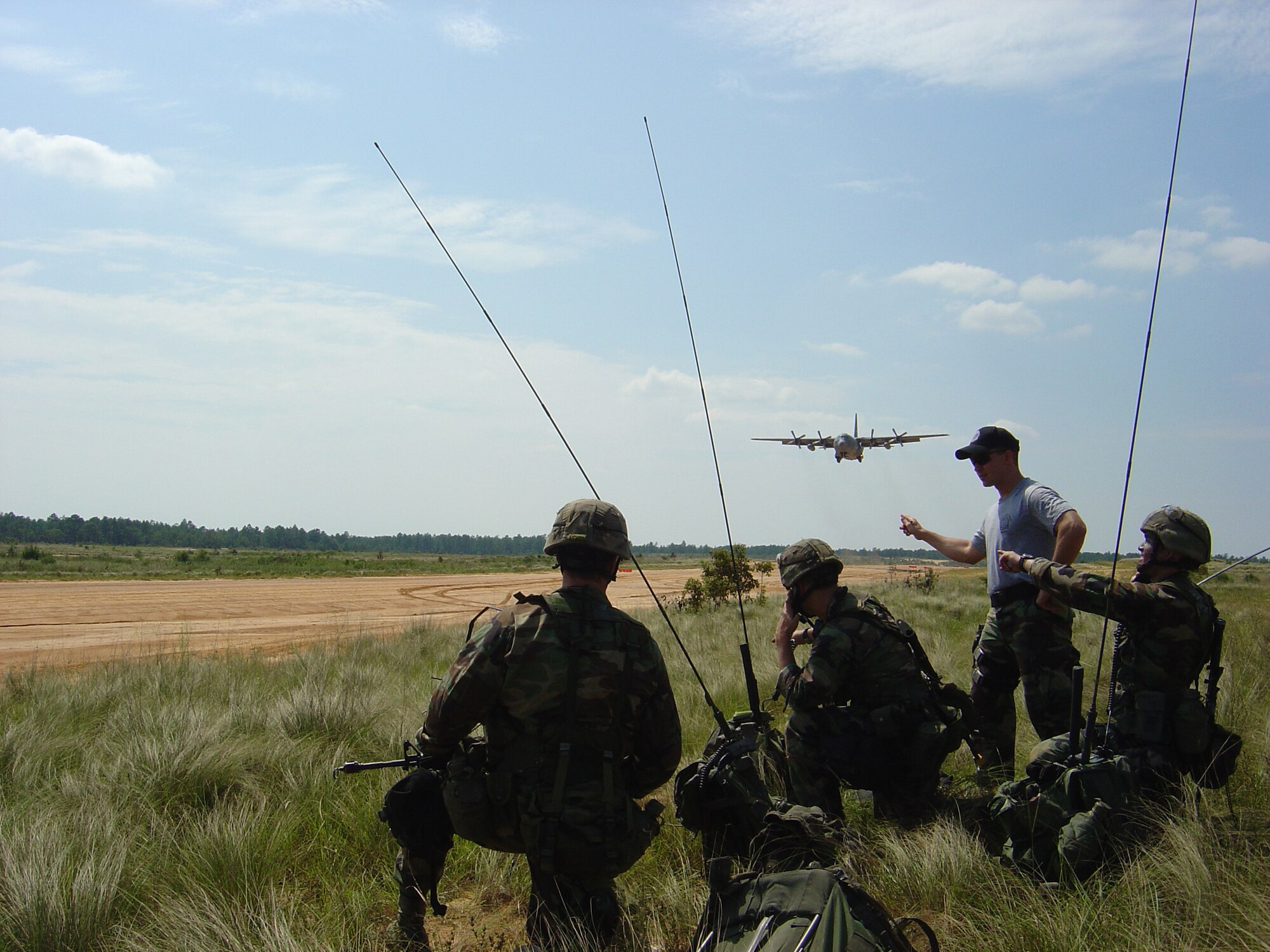 A Combat Control School instructor provides instruction at the control point during a field training exercise on the Luzon Landing zone near the CCS at Pope Air Force Base, N.C. (U.S. Air Force Photo)