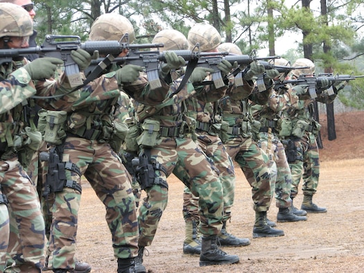 Combat control trainees at the combat control school at Pope Air Force Base, N.C. learn advanced shooting techniques on line. These techniques are taught to the students during their tactics block. (U.S. Air Force Photo)