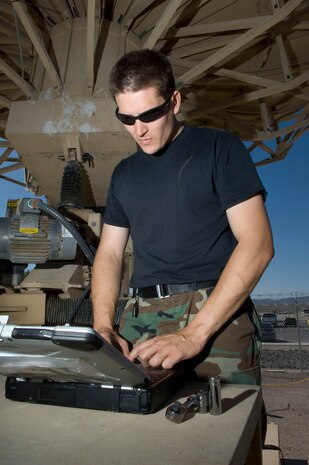 Technical Sgt. Chris Couture, a MQ-1 Predator communication supervisor assigned to the 232nd Operations Squadron, Nevada Air National Guard Las Vegas, Nev., input a technical order for the predator primary satellite link (PPSL) here May 19, 2008. The predator primary satellite link, is the focal point of communication to the MQ-1 predator and the pilots manning the aircraft from the ground control station.
(U.S. Air Force Photo by/Senior Airman Larry E. Reid Jr.)