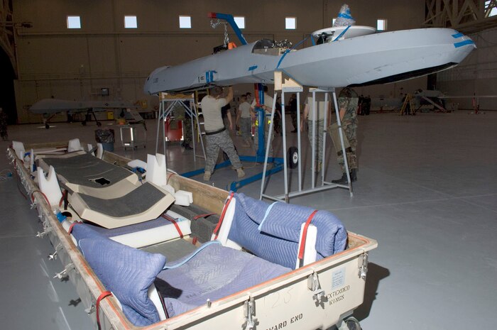 Airmen assigned to the 432nd Aircraft Maintenance Squadron, put together a MQ-1 Predator after returning from Afghanistan here May 19, 2008.
(U.S. Air Force Photo by/Senior Airman Larry E. Reid Jr.)