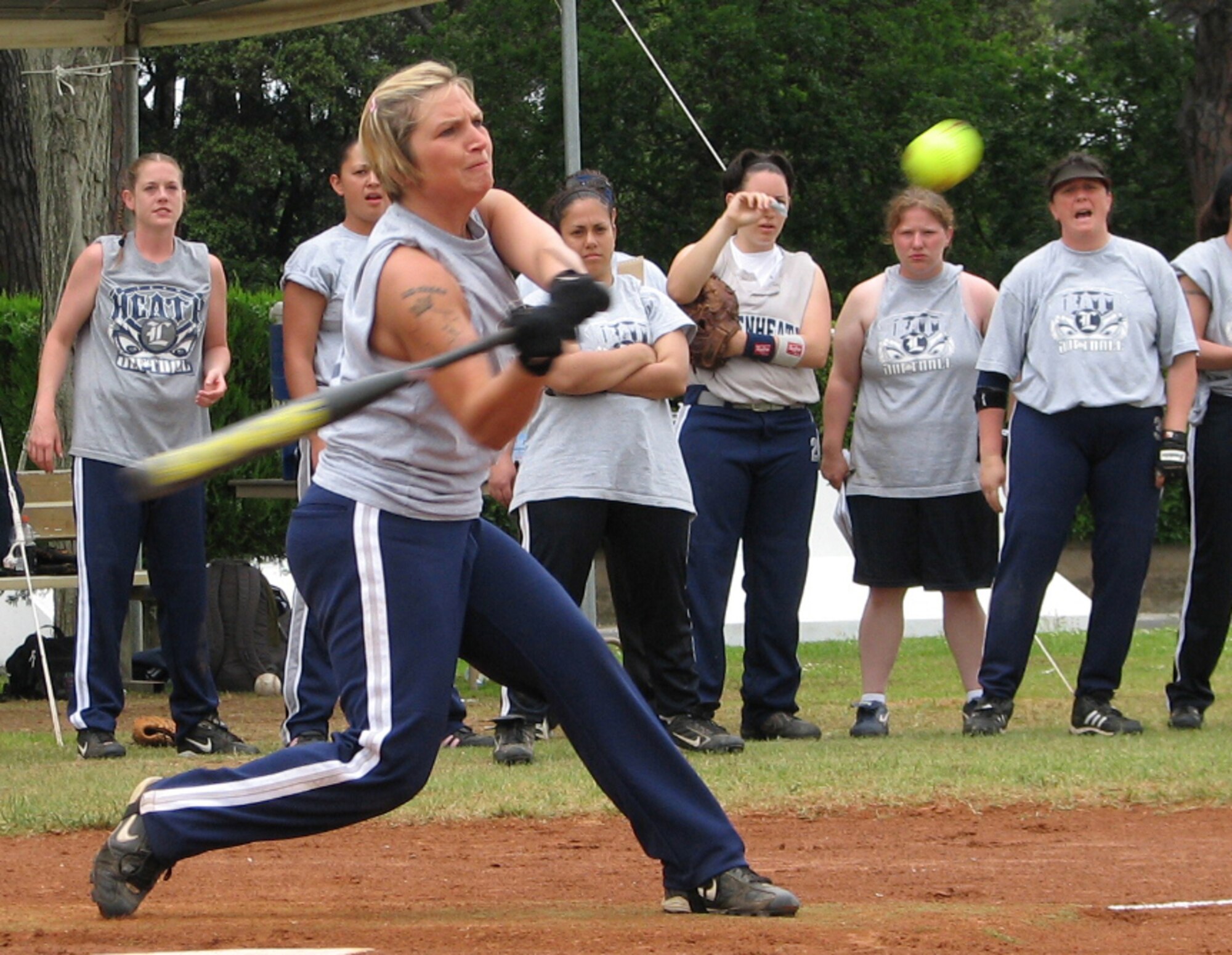 Emily Jones, Lakenheath Women's Varsity softball team's third baseman, swings at a pitch during a game against the Naval Air Station Sigonella Women's team at Camp Darby, Italy. The Lakenheath team lost to the SIgonella team during the Camp Darby's European Open Softball tournament.  The women’s team took fourth place and the Lakenheath Men's Varsity team took fifth place in the tournament. (U.S. Air Force photo by Tech. Sgt. Jason Gagnon) 