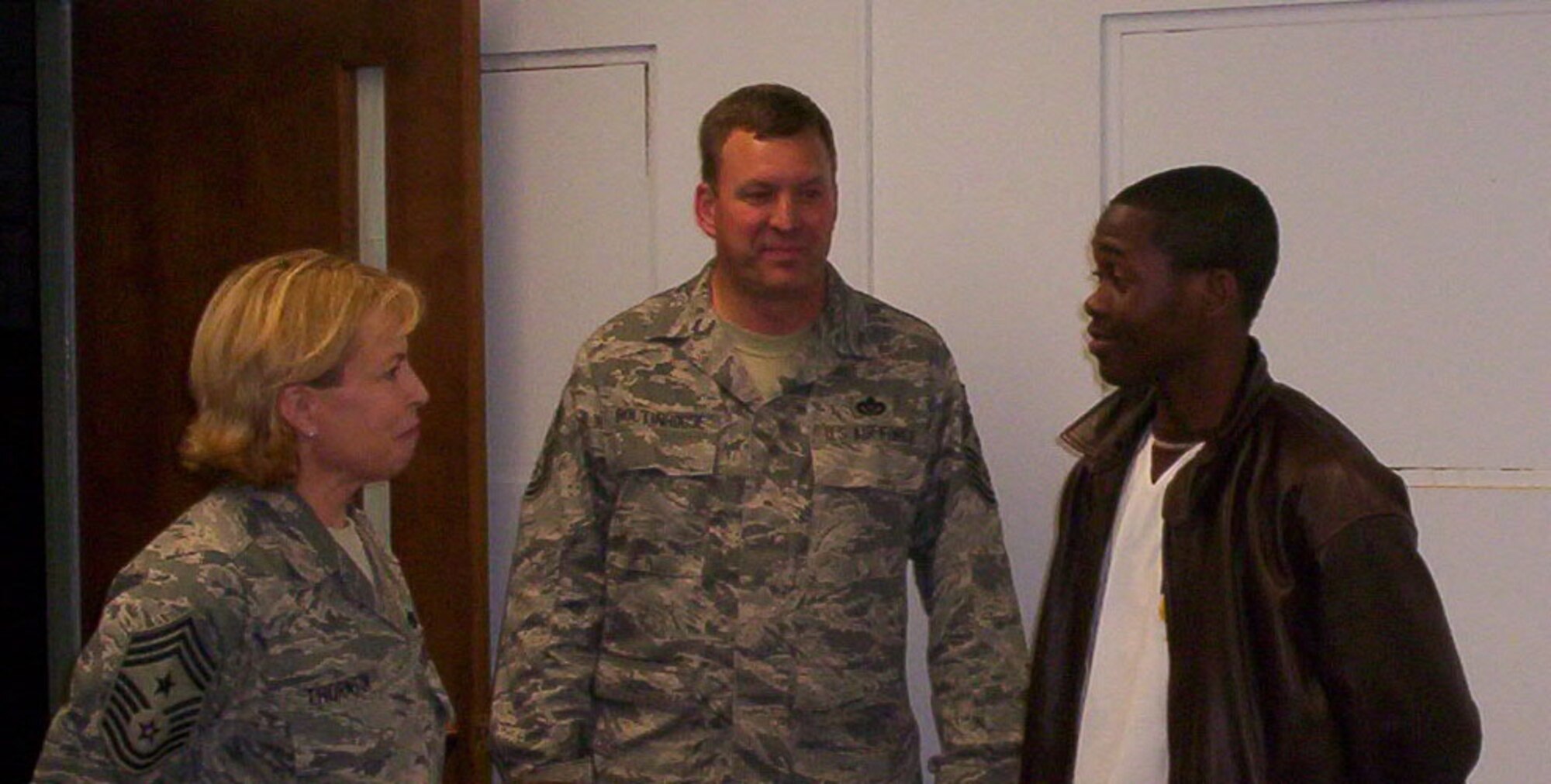 SEYMOUR JOHNSON AIR FORCE BASE, N.C. -- Airmen First Class Jocquell McDaniel was welcomed to the 916th Services Flight in May by 916th Air Refueling Wing Command Chief Master Sgt. Lester Boltinhouse (center) and 4th AF Command Chief Master Sgt. Patricia Thornton. Airmen McDaniel encountered several obstacles on his journey to his drill weekend, but was dedicated to making the unit training assembly.