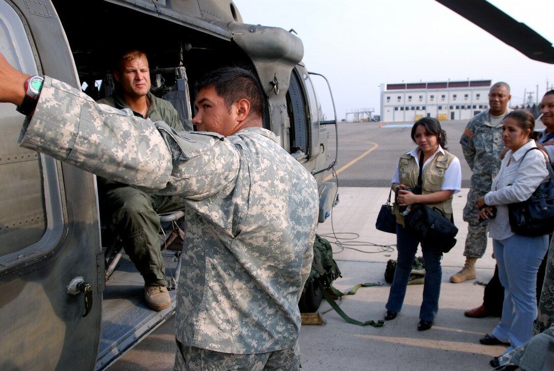 US Army Sergeant translates helicopter safety procedures into Spanish for local Honduran media representatives before they depart for a trip to the northern coast of Honduras where US Service members are conducting remote medical support for local villages. Photo taken at Soto Cano Air Base on May 03, 2008 as part of Beyond the Horizons. Beyond the Horizons is a joint forces training exercise  between the United States and Honduras to foster goodwill and improve relations between the two nations. (Photo by First Lieutenant Ryan Hanna)(Released)