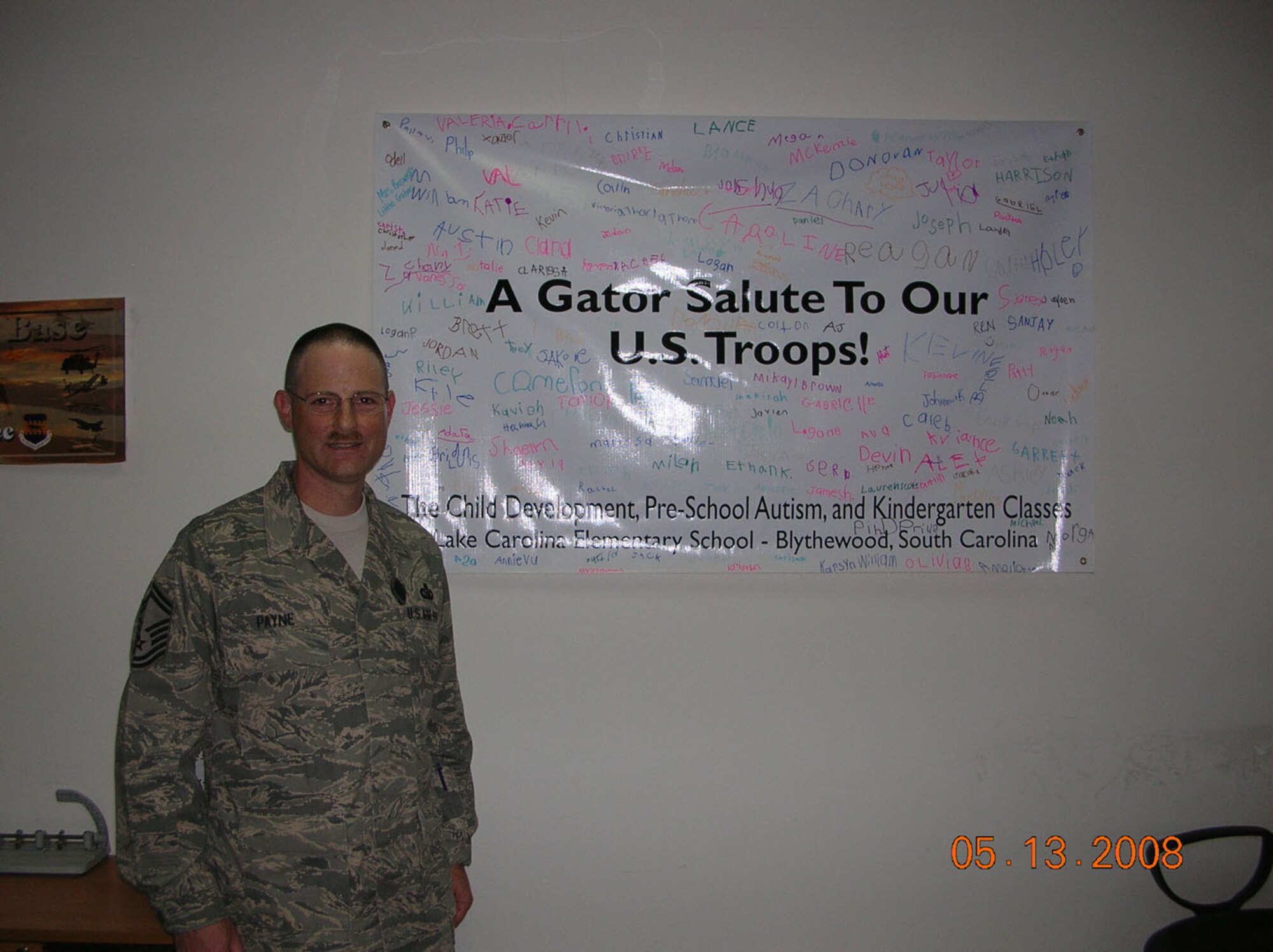 SEYMOUR JOHNSON AIR FORCE BASE, N.C. -- Senior Master Sgt. Bryan Payne arrived in Iraq in May to a sign from home. Sgt. Payne, a Reservist with the 916th Communication Squadron was welcomed to Balad with a sign from his son's South Carolina school, Lake Carolina Elementary. Sgt. Payne commented that of all the military signs present this was the only one from an outside location and that he was very touched that it was there upon his arrival.