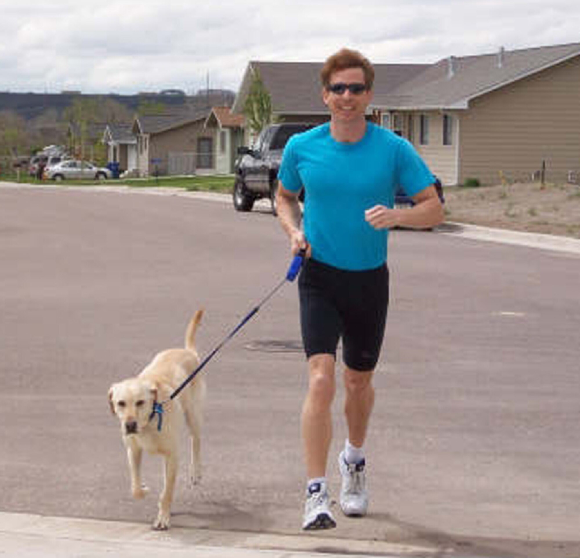 Eric Thayer returns to his home with his running mate, Jasper, following a weekend jaunt that is part of his regular exercise routine. (Courtesy photo)