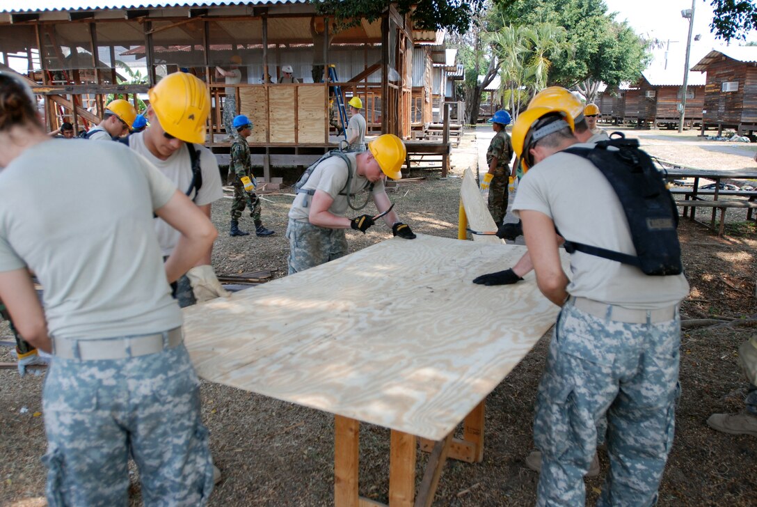 US Army Soldiers of the 389th Engineering Company take part a building deconstruction during which nails and other extra materials would be removed so that the resources could be recycled and used again in local projects at Soto Cano Air Base, Honduras on May 01, 2008 as part of Beyond the Horizons. Beyond the Horizons is a joint forces training exercise between the United States and Honduras that provides opportunities for U.S. personnel to refine engineering, medical, mobilization and deployment skills. (Photo by First Lieutenant Ryan Hanna)(Released)