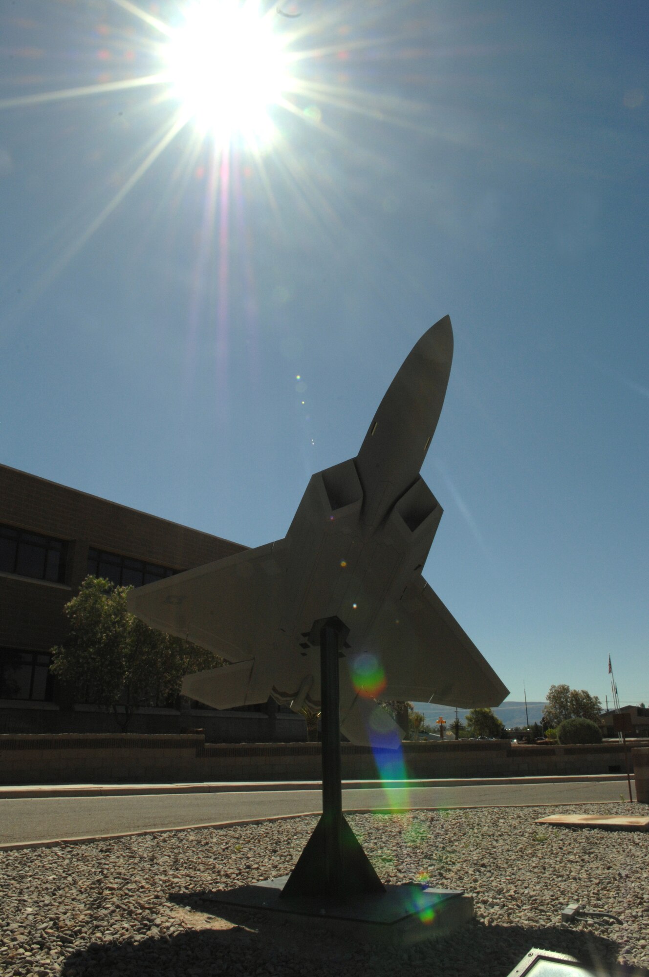 On May 20, members of Team Holloman replaced the model F-117A Nighthawk with this model of an F-22A Raptor at the 49th Fighter Wing headquarters building at Holloman Air Force Base, N.M. The F-22A model is one-fifth the size of an actual Raptor and weighs 375 pounds. It sits in front of the building along with a model of a German Tornado. (U.S. Air Force photo/Airman Sondra M. Wieseler)