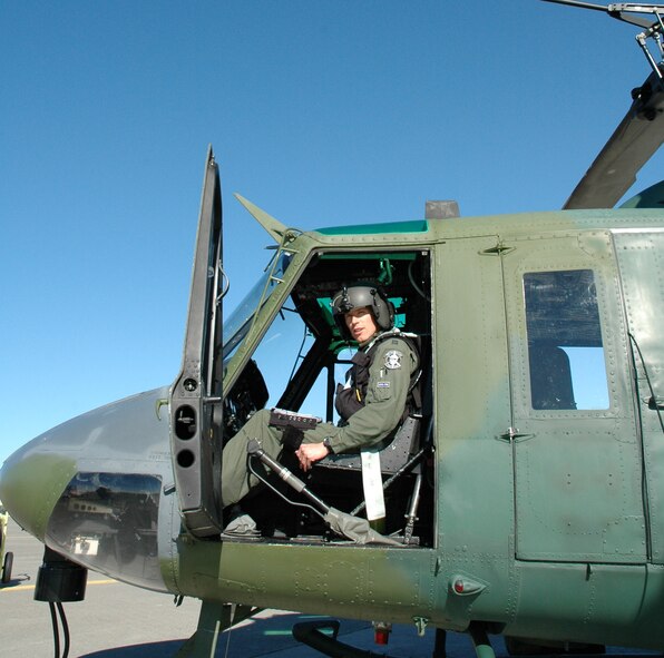 Capt. Phillip Bryant pre-flights his UH-1N "Huey" prior to taking off for another flying mission May 28. Captain Bryant and his crew rescued a man stranded in the Dearborn River after the raft he was riding in hit a rock and capsized May 25. (U.S. Air Force photo/Airman 1st Class Emerald Ralston)