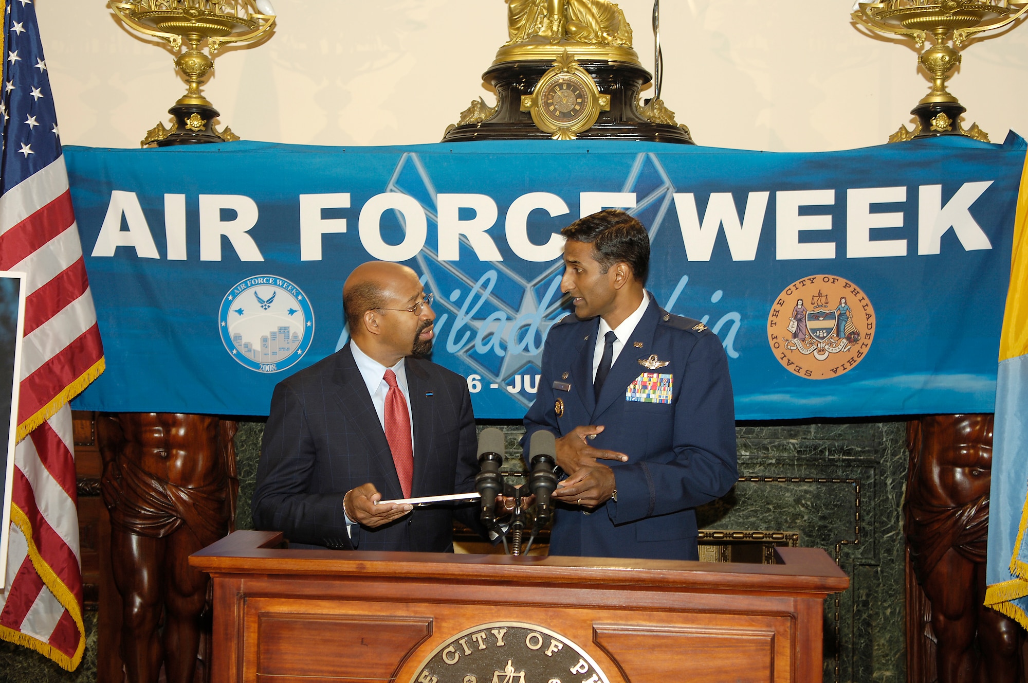 Col. Balan Ayyar, 305th Air Mobility Wing commander, and Philadelphia Mayor Michael Nutter exchanged “keys” during a proclamation ceremony held May 21 at City Hall to officially kick off Air Force Week in Philadelphia. Colonel Ayyar presented Mayor Nutter with a key to a McGuire C-17 Globemaster III. Mayor Nutter gave Colonel Ayyar honorary “Keys to the City” and a Philadelphia Liberty Bell. Air Force Week in Philadelphia will consist of various events throughout the city May 26-June 2. (U.S. Air Force photo/Kenn Mann)