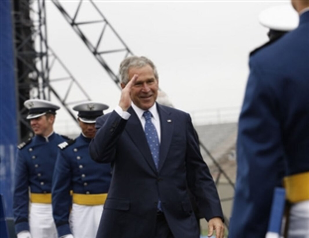 President George W. Bush salutes a graduate of the U. S. Air Force Academy during commencement exercises May 28, 2008, in Colorado Springs, Colo.