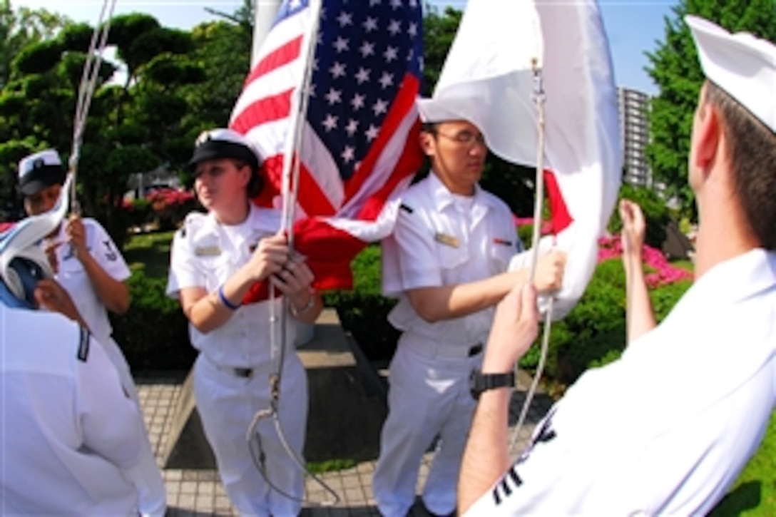 U.S. Navy sailors prepare the flags for morning colors for fleet activities in Yokosuka, Japan, May 22, 2008.

